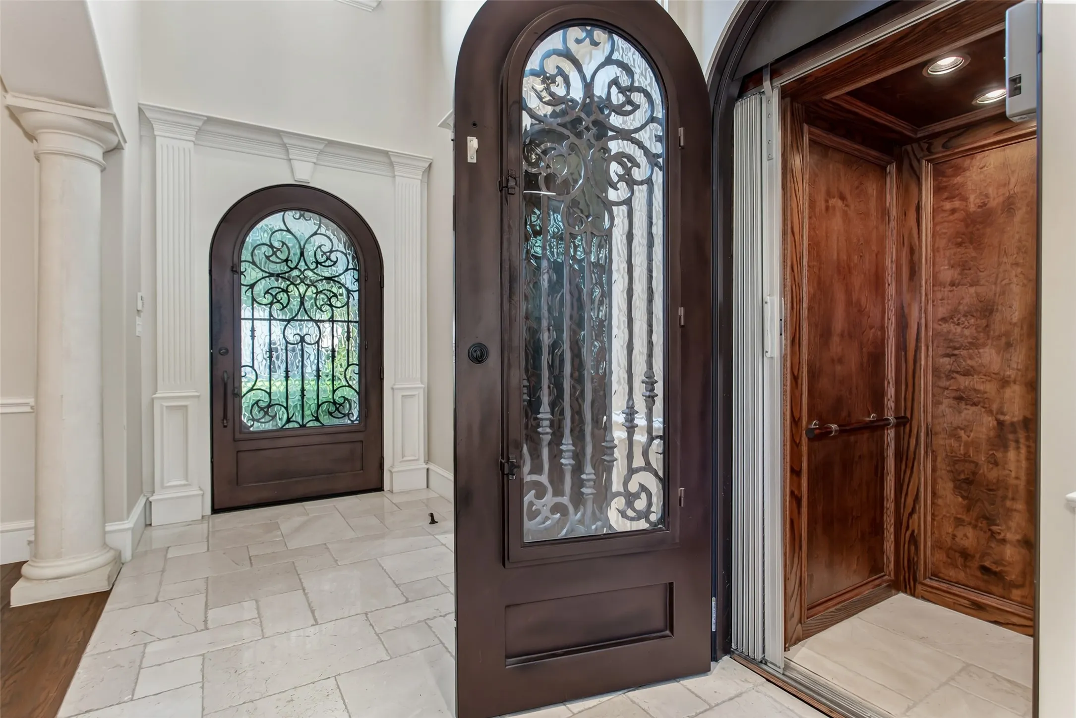 Private wood-paneled elevator provides effortless access between floors, combining everyday convenience with timeless craftsmanship and luxury
