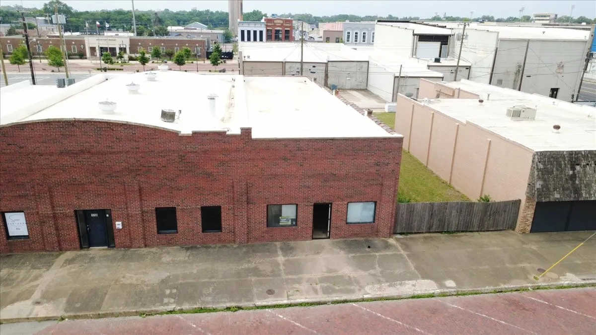 Brick commercial building with a light-colored flat roof