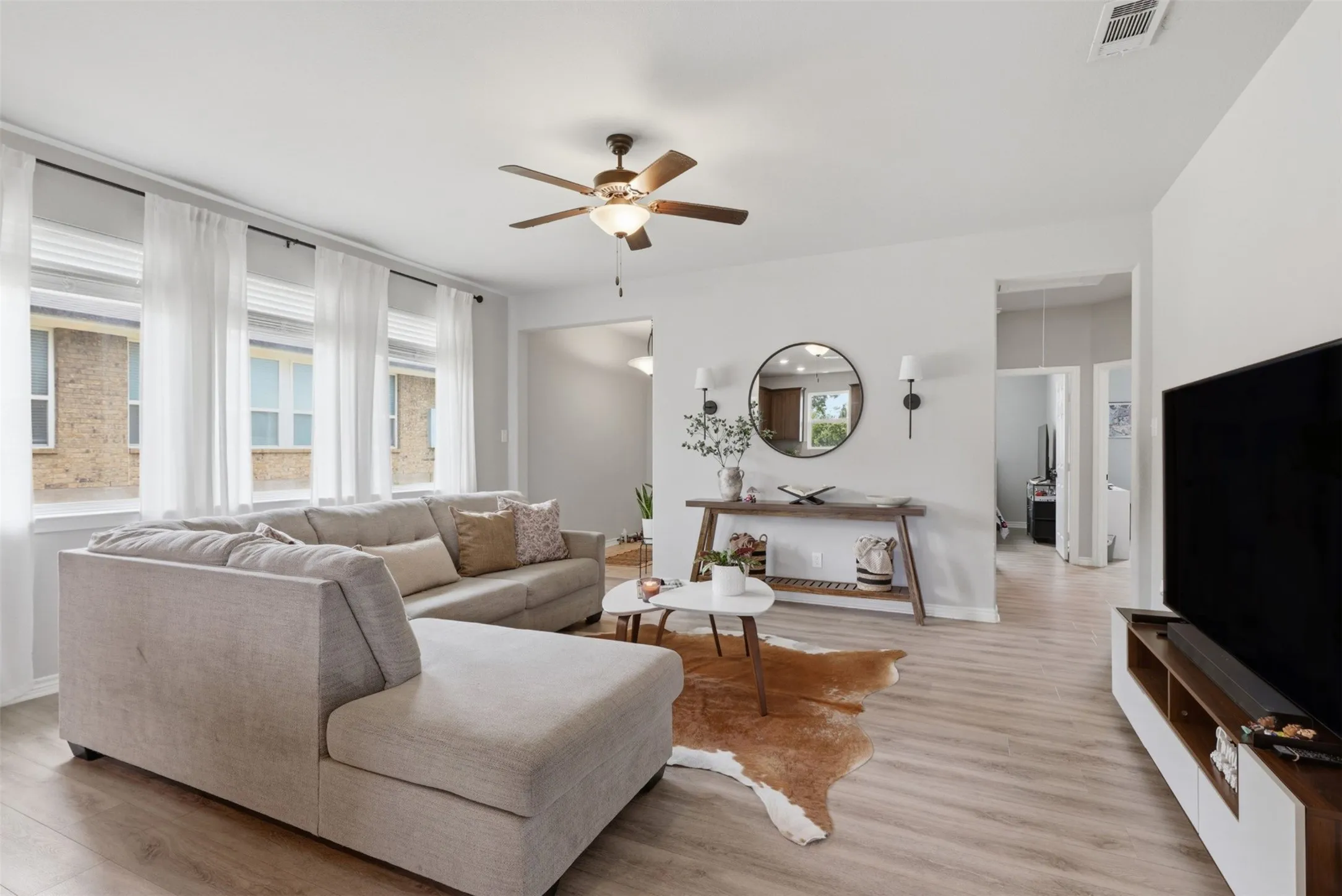 Bright living area with wood-finish flooring