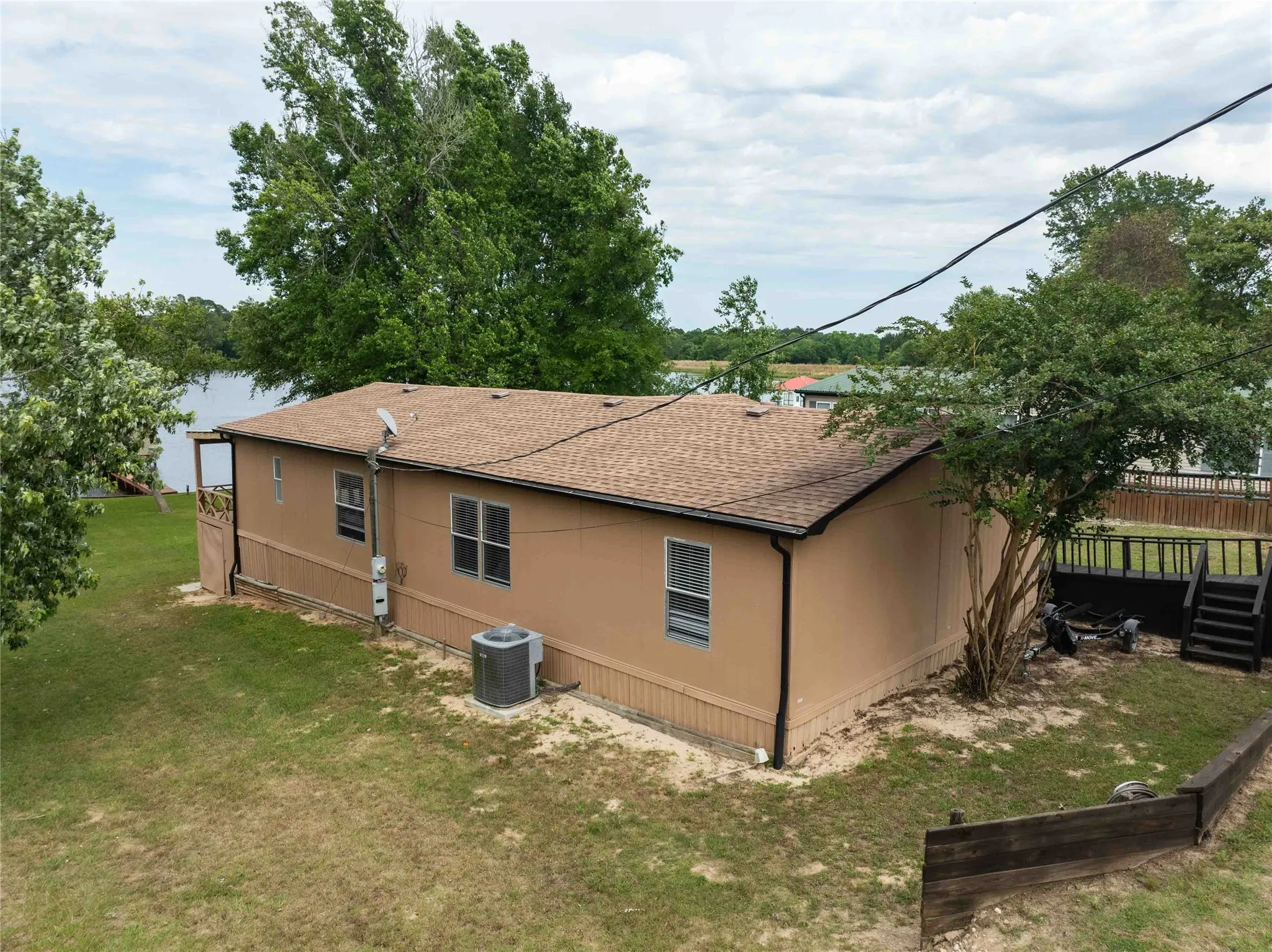 back side of home with new AC / heat unit