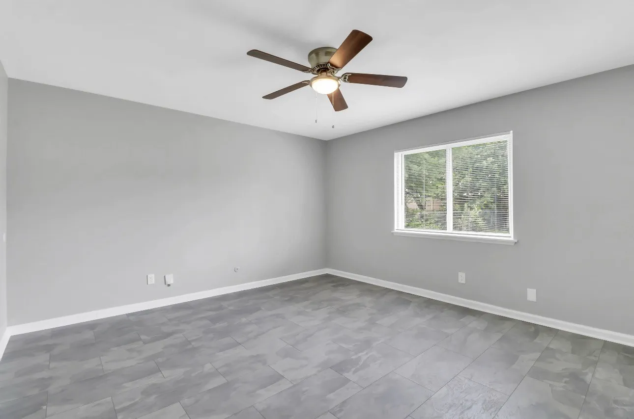 Neutral gray walls complementing gray tile flooring