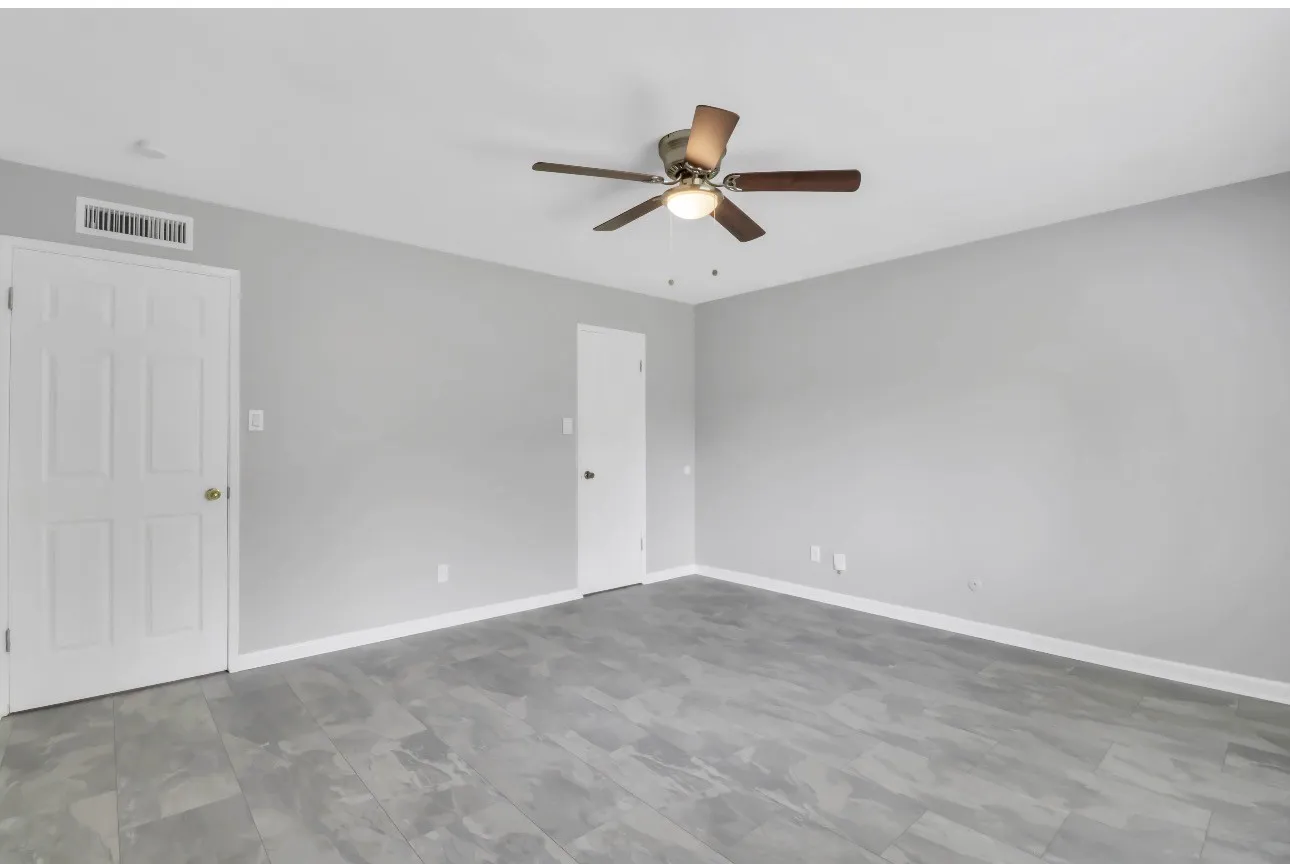 Main bedroom area with large walk-in closet and ensuite full bathroom.