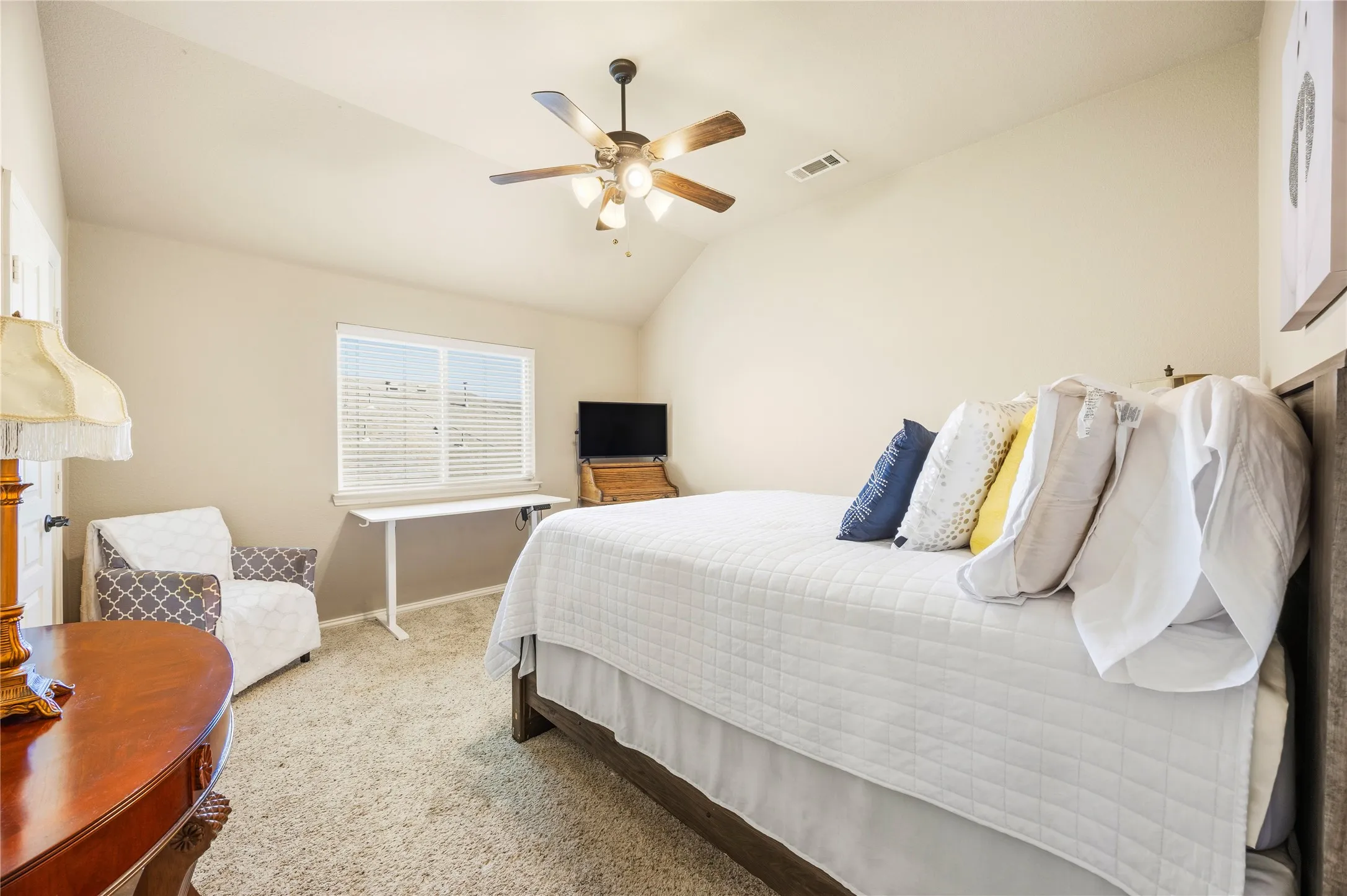3rd Bedroom - 2nd floor, featuring vaulted ceiling room, ceiling fan, carpet flooring and a window with blinds.