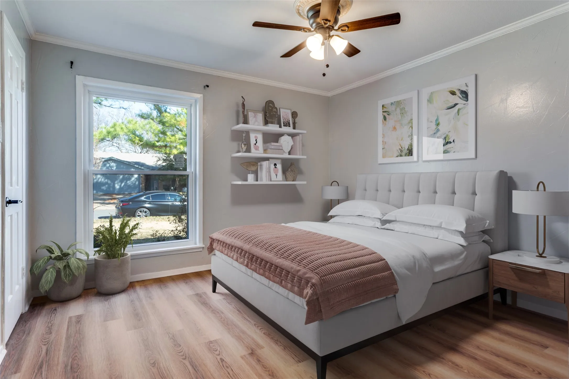 Bedroom featuring wood-finish flooring, a ceiling fan with integrated lighting, and a window with white trim (virtual staging)