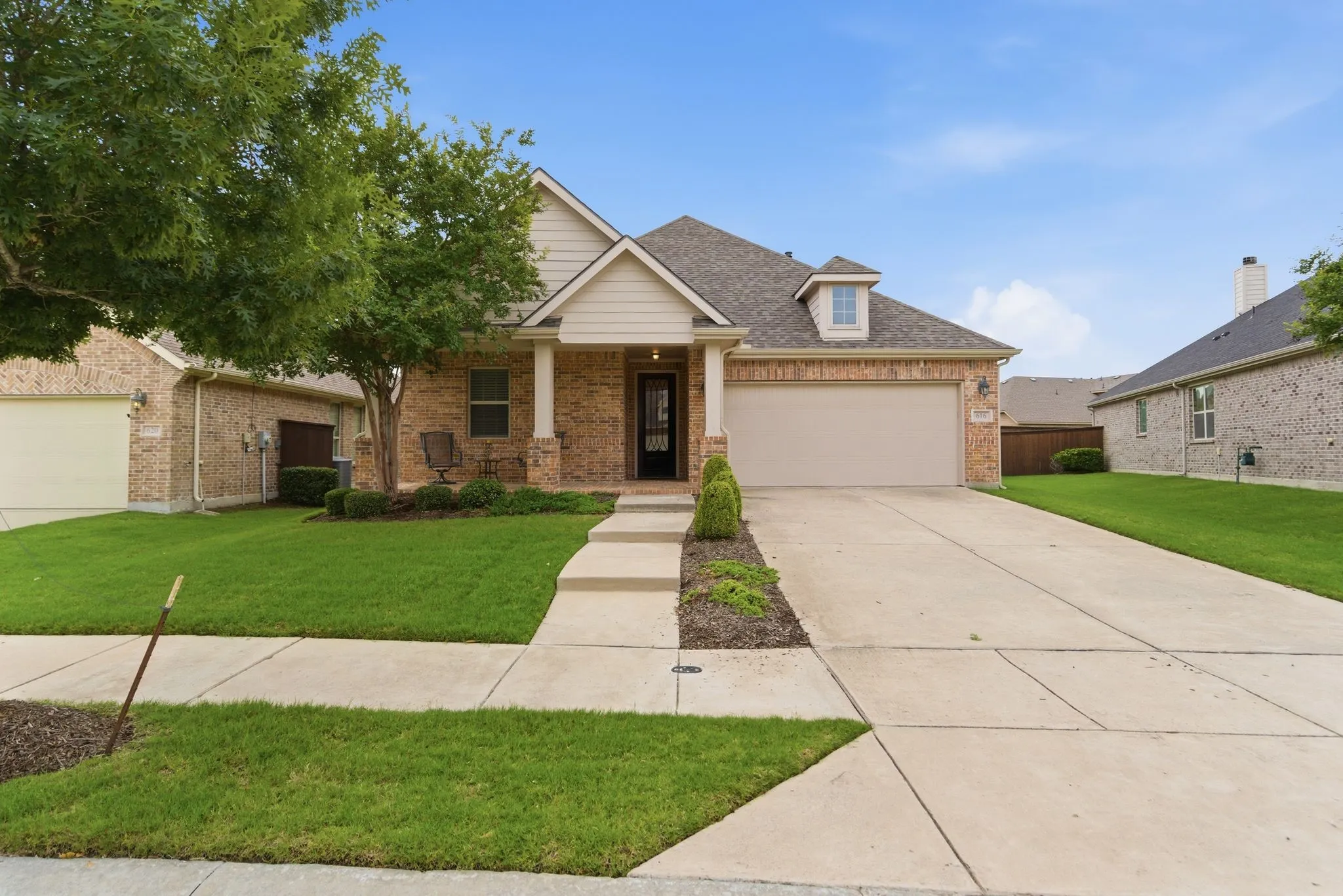 Inviting front elevation with covered front porch.
