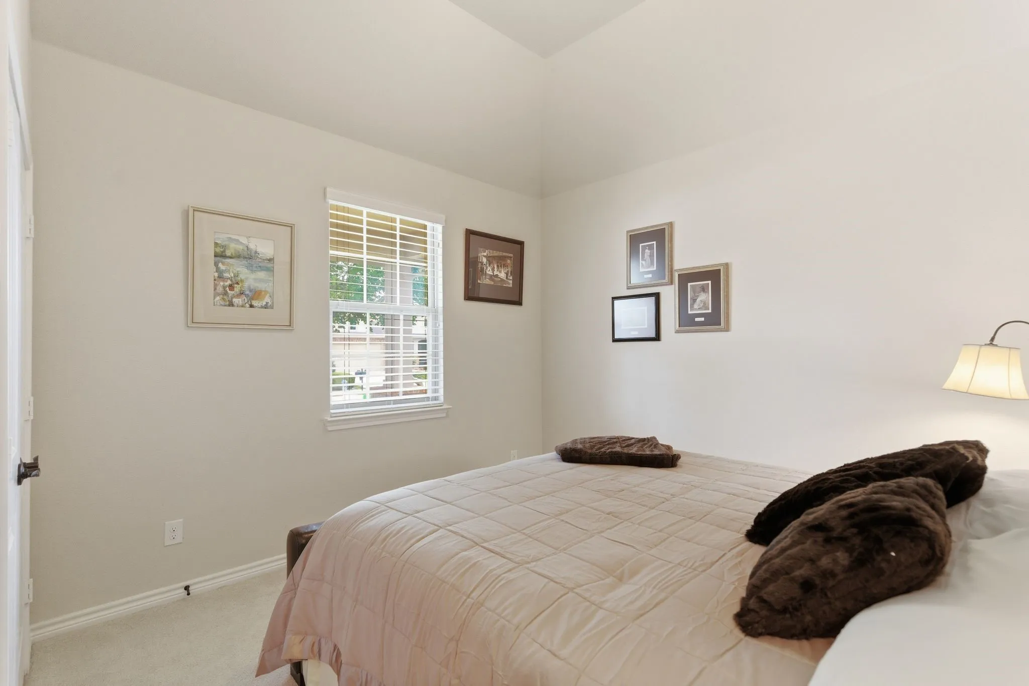 Ample size guest bedroom with private hallway access to full bath.