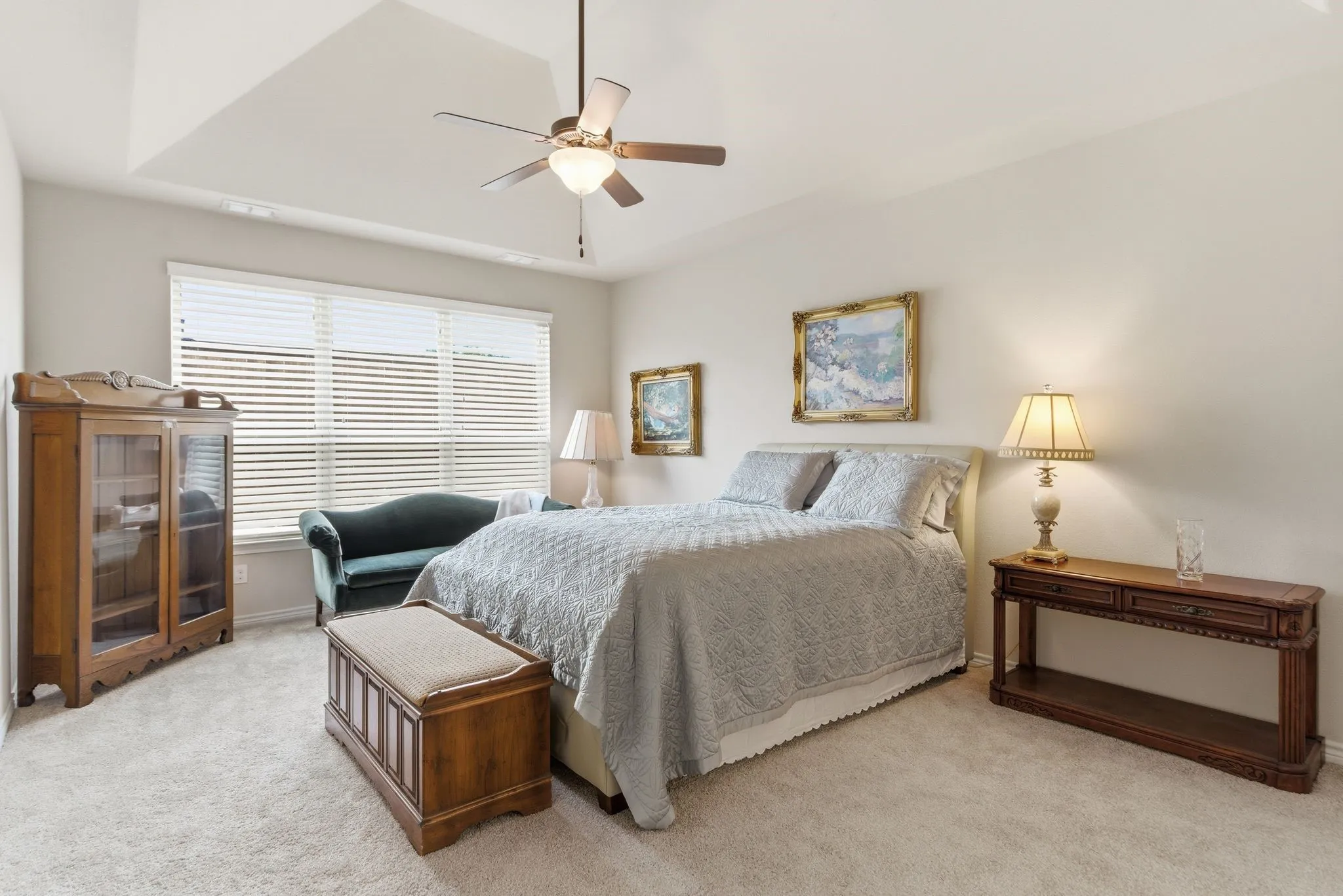 Primary bedroom oasis with sitting area.