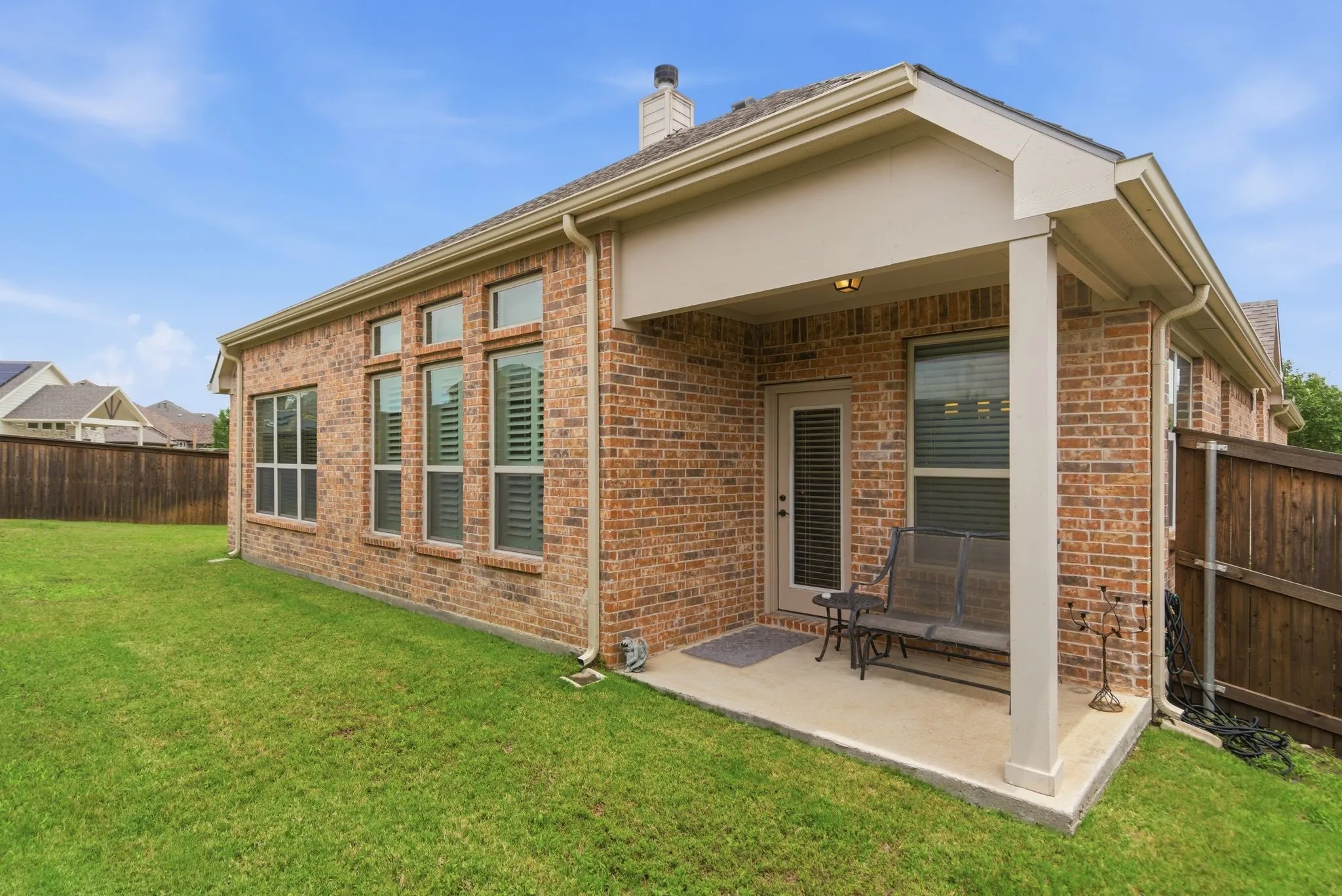 Enjoy the shade of the covered back patio.