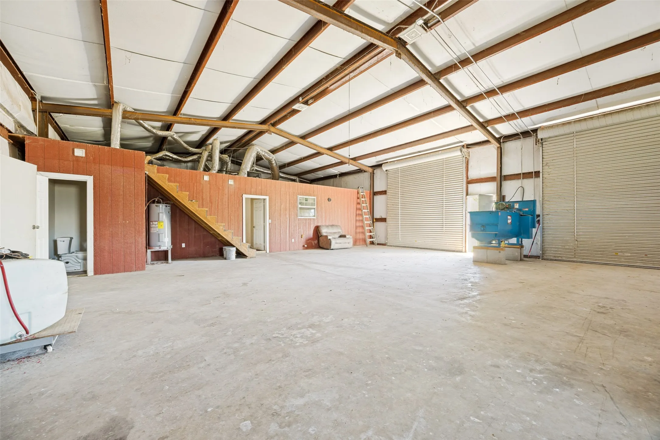 Spacious interior with high ceilings and exposed wooden beams