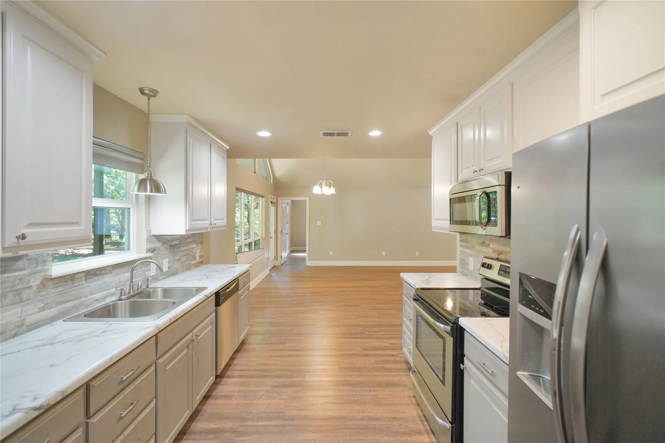 Modern kitchen with white upper and grey lower cabinetry