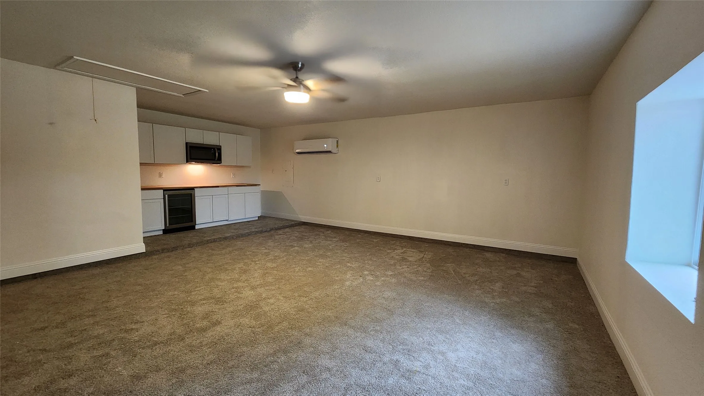 Converted garage is a Huge Room with it's own AC