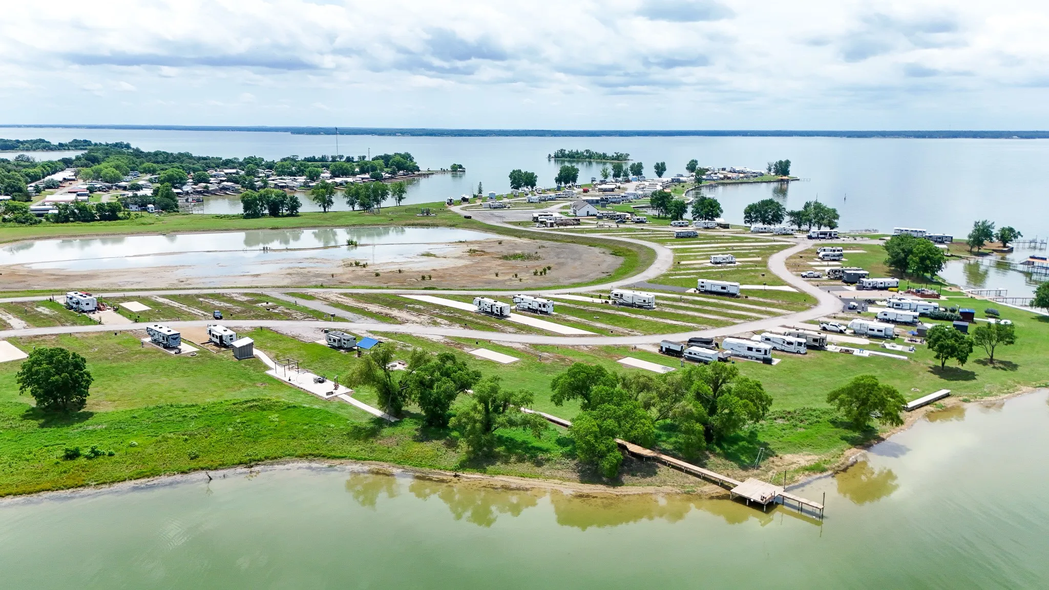 Waterfront property featuring multiple RV parking sites and direct lake access
