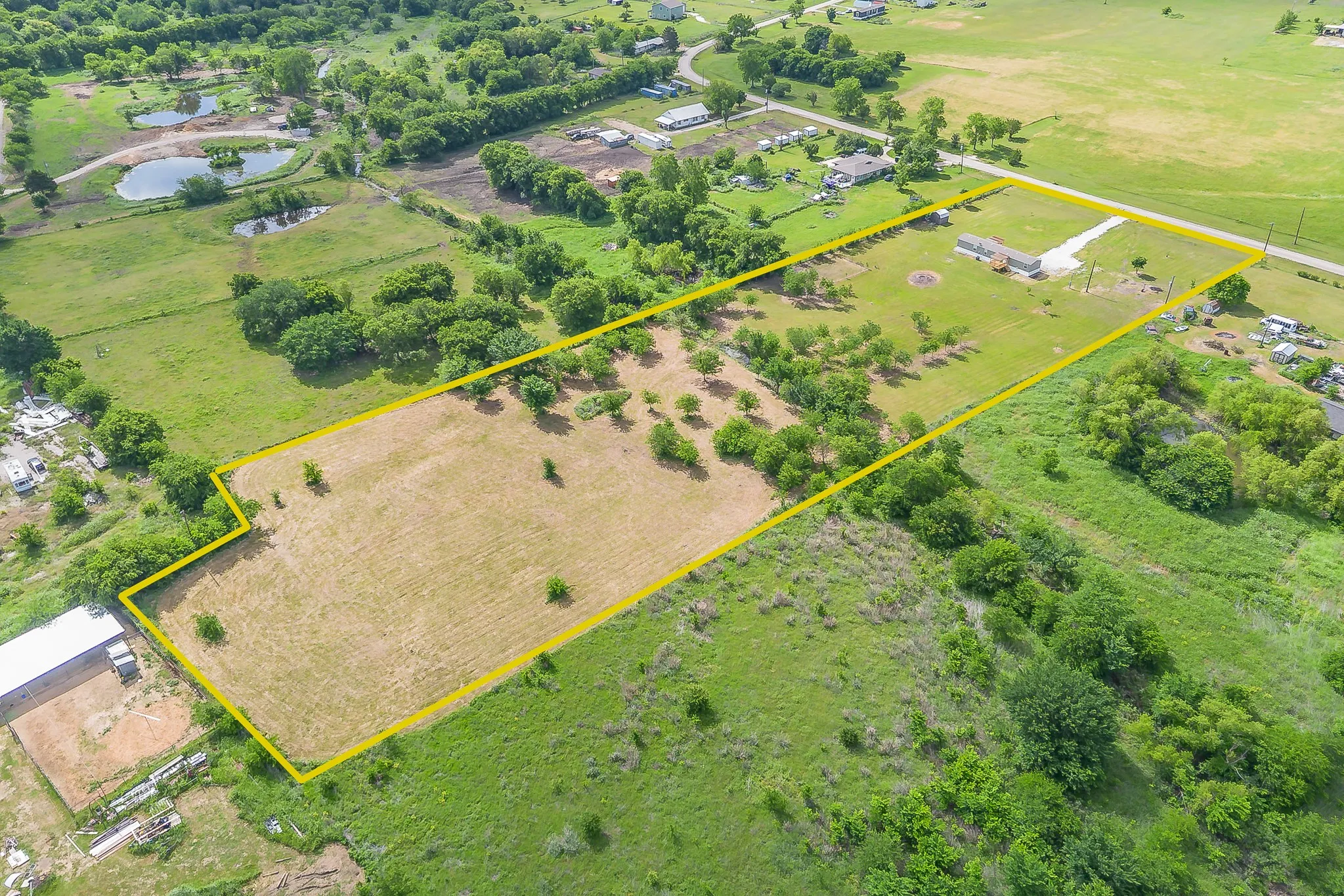 Aerial property boundary view highlighting the size and layout of the land.