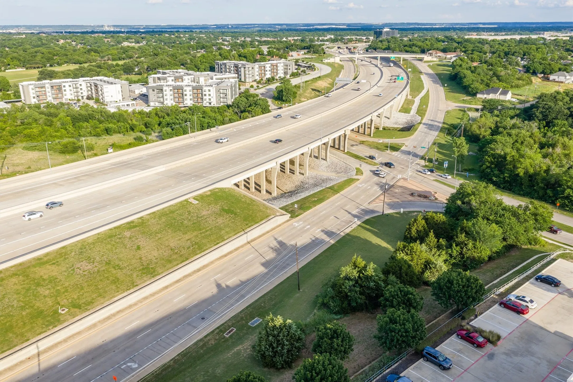 Aerial perspective showcasing a multi-lane highway system with multiple roadways and overpasses