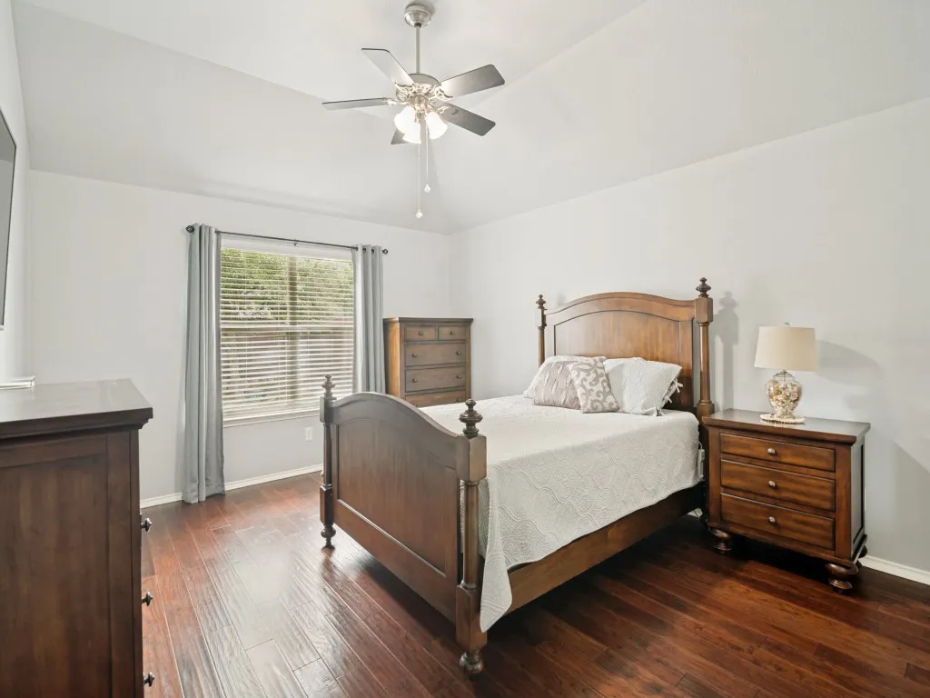 Room featuring vaulted ceilings and dark wood-finish flooring