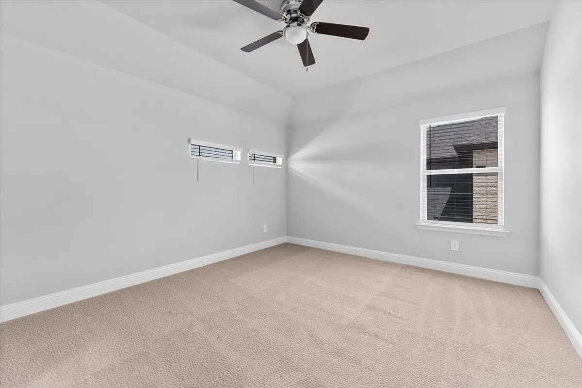 Neutral-toned carpeting paired with light gray walls