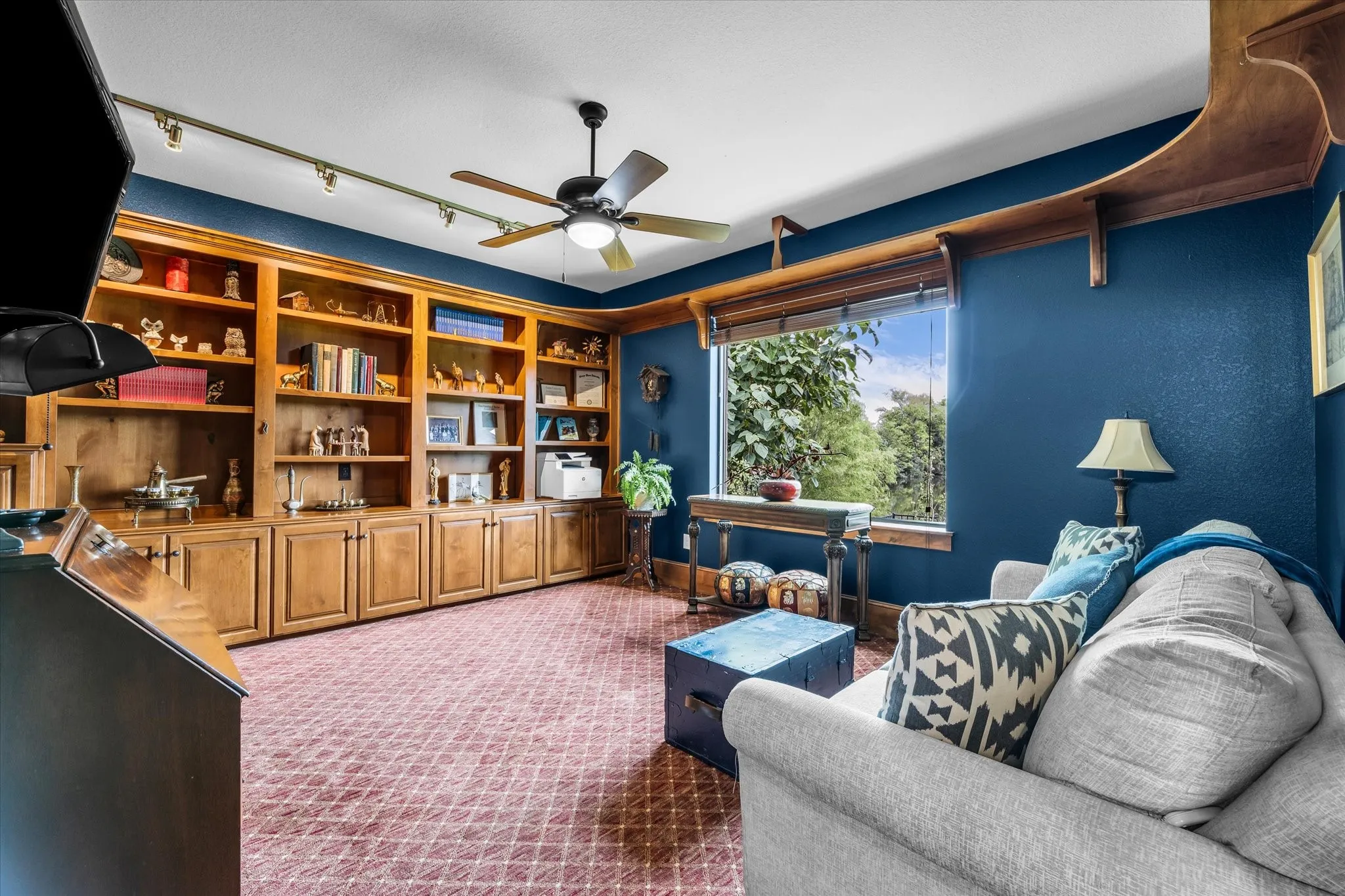 Custom built-in wood cabinetry with shelving and lower storage
