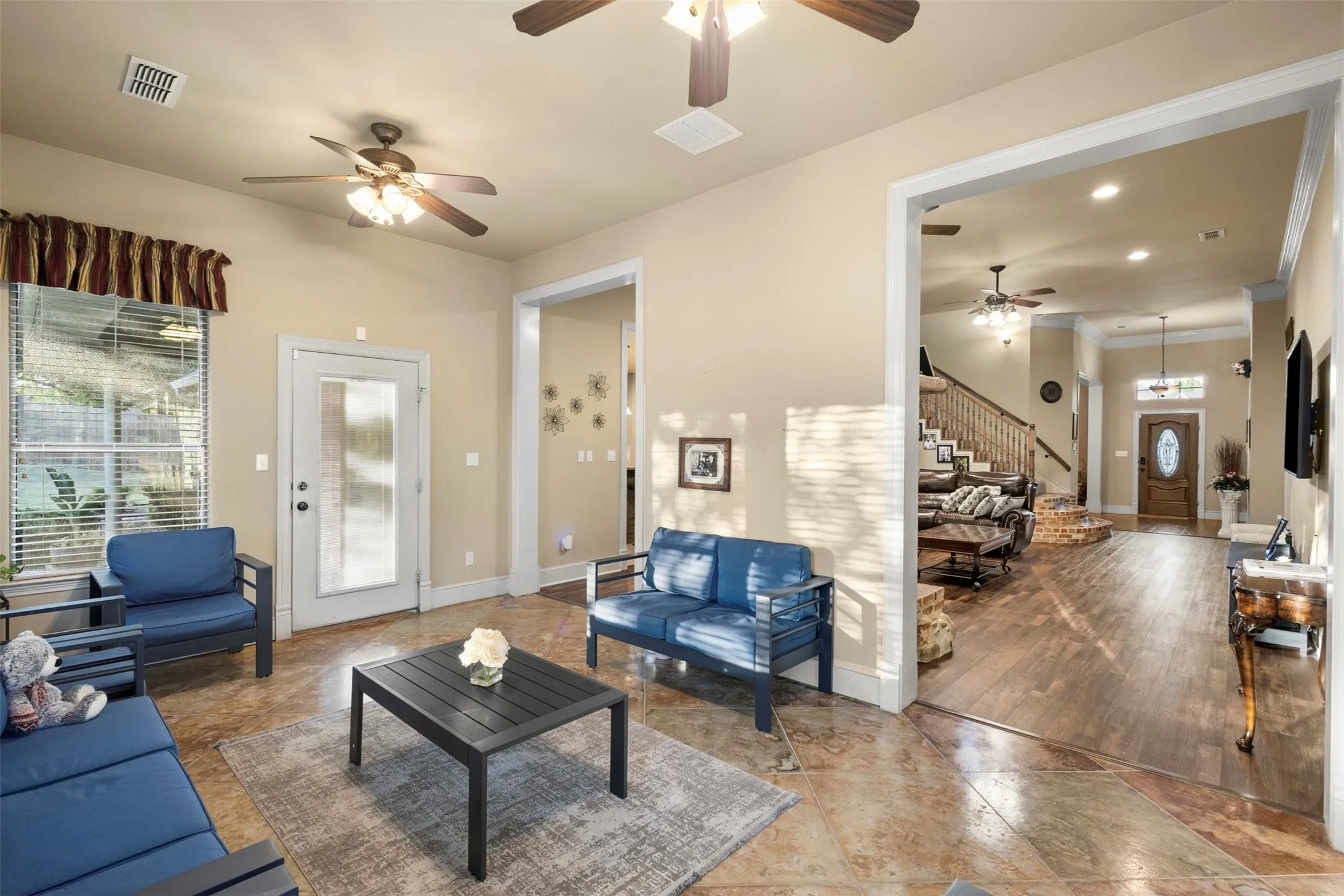Seller calls this the sunroom.  It is a lovely extension to the main living space with plenty of natural light and doors to both outside patios. Grab a book and enjoy the view outside.
