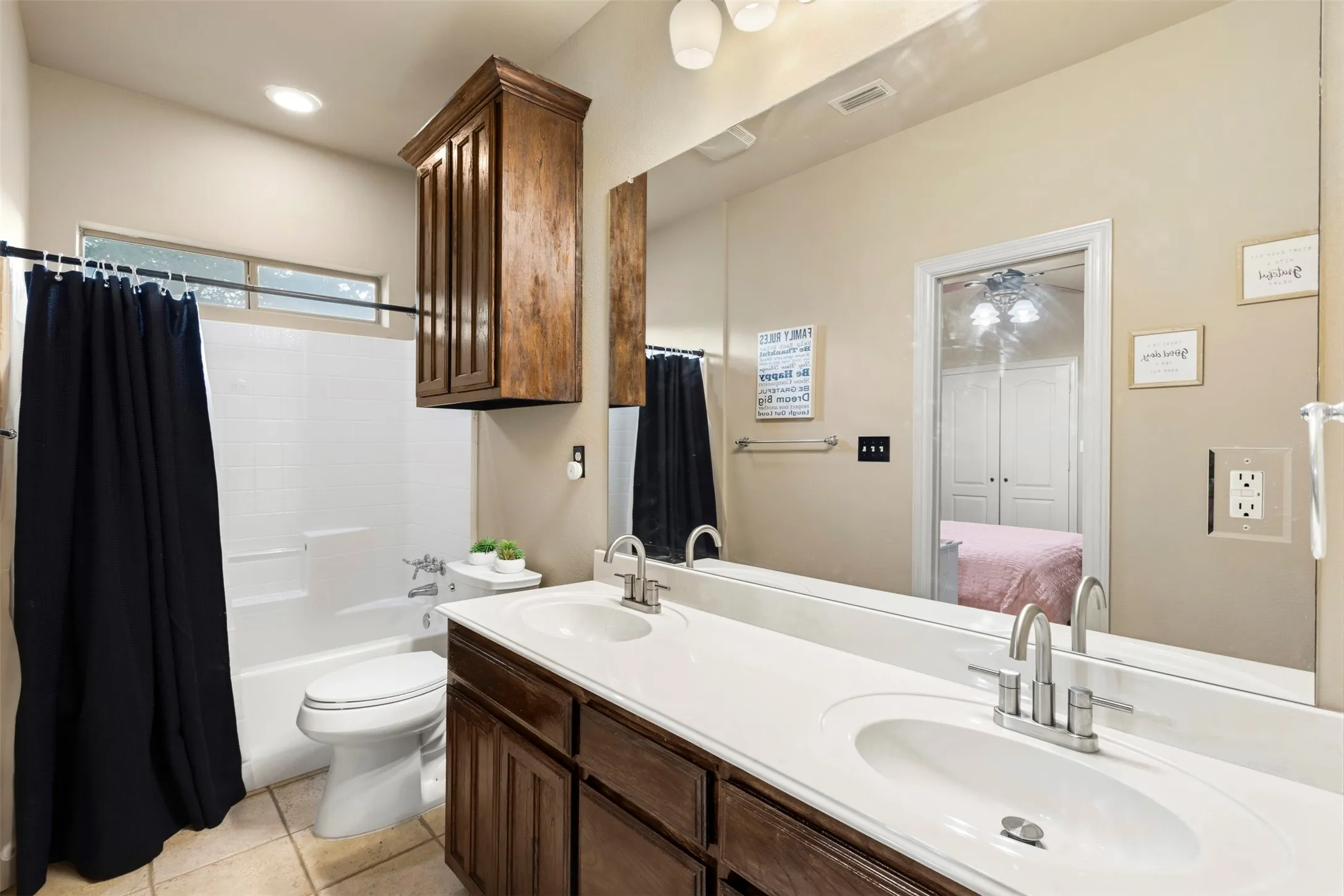 Jack-n-Jill Bathroom with two sinks.  Neutral colors.