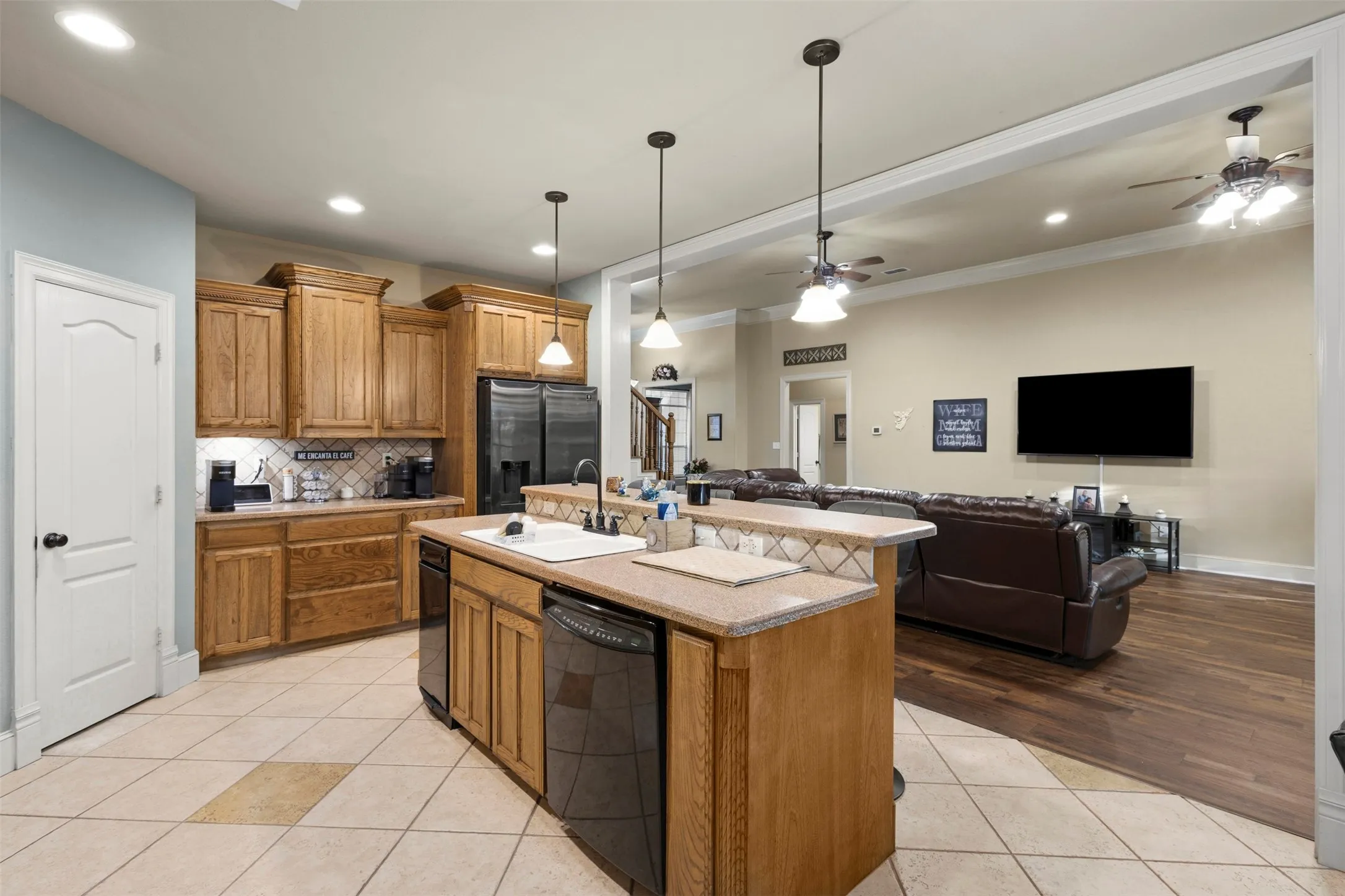 Stay connected to friends and family while being in the kitchen.  Decorative lights. Walk-in pantry.  Great coffee area.  Refrigerator stays with acceptable offer.