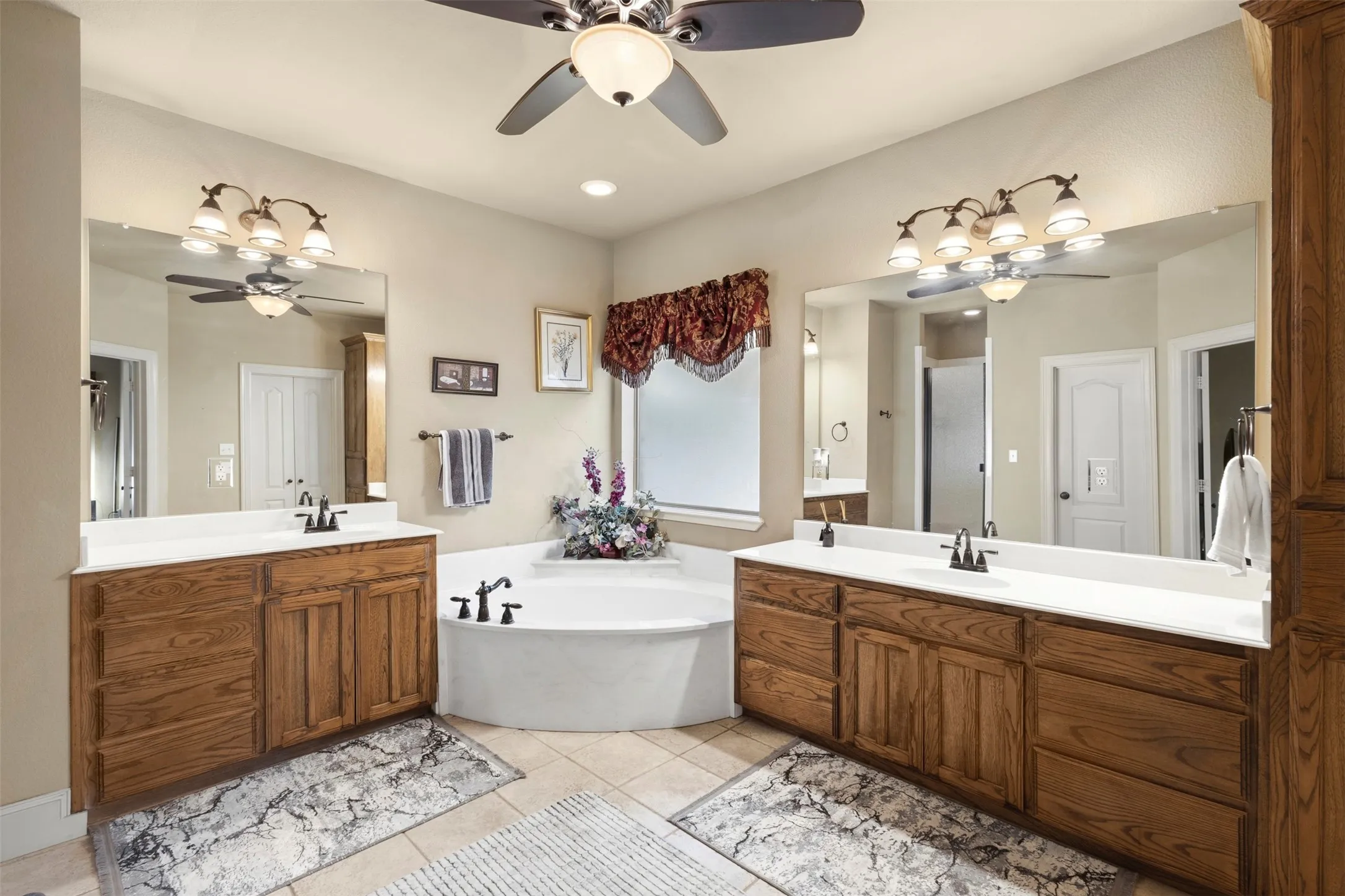 No more fighting for space.  Separate vanities.  Garden tub for soaking.
