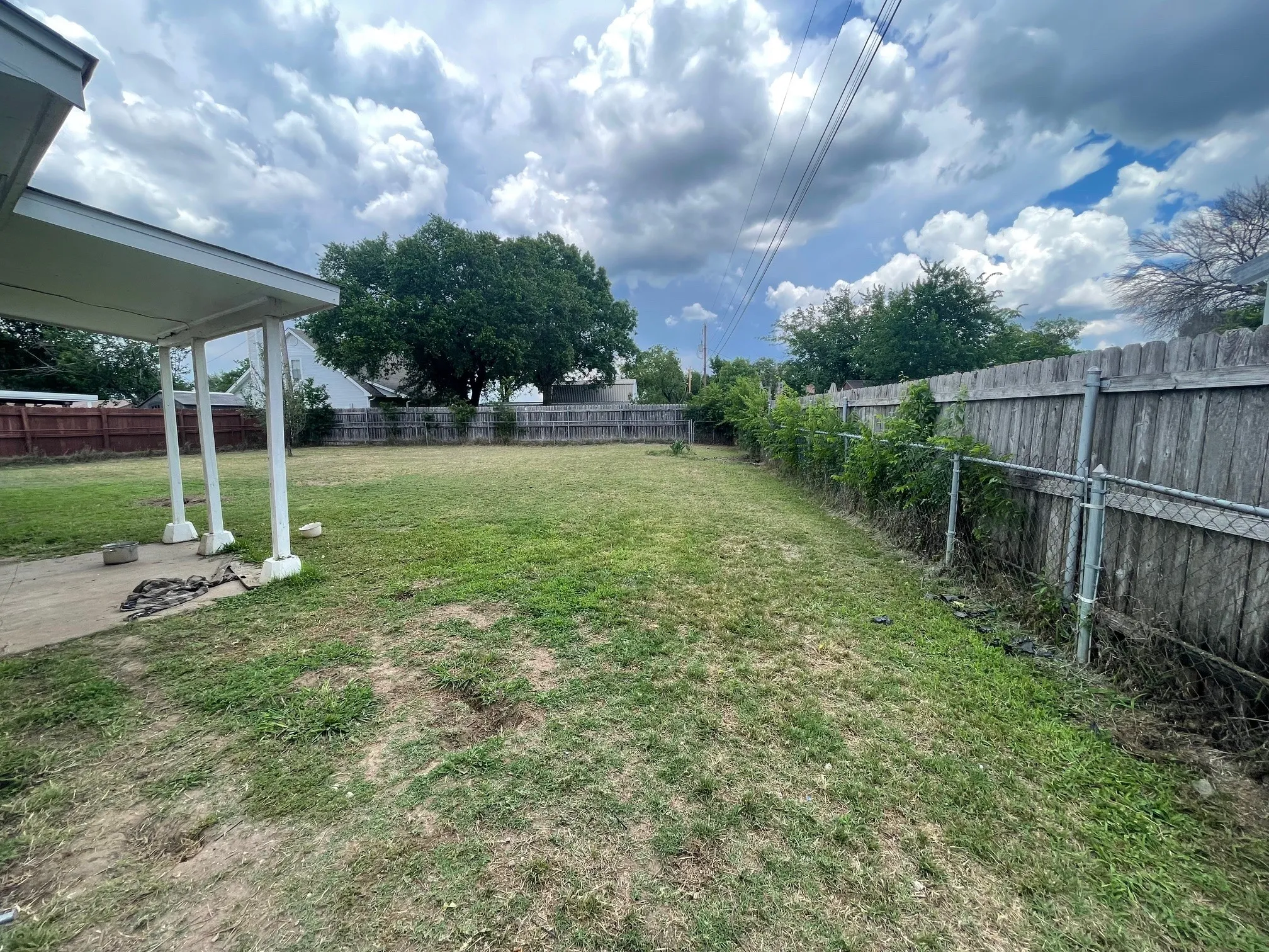 Another view of backyard and fencing.