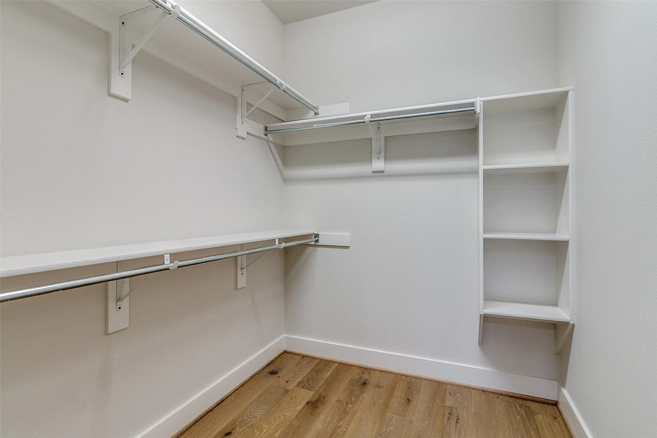 One of two large walk-ins in primary bedroom