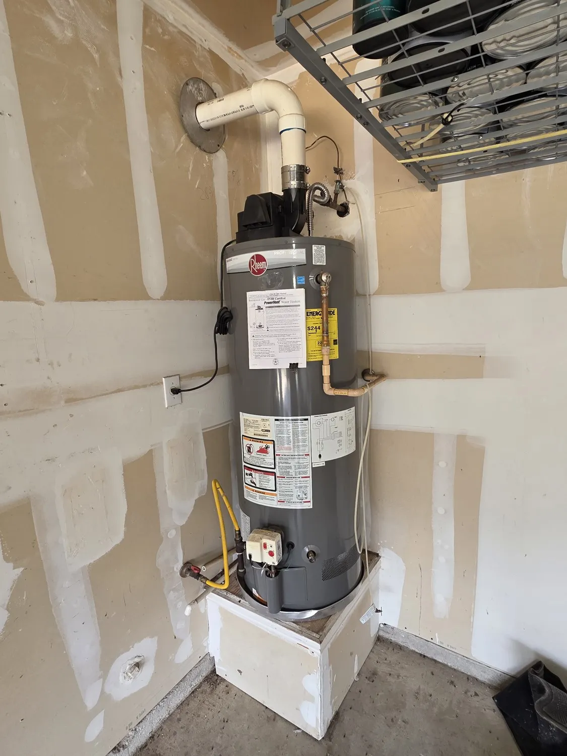 Gray water heater with PVC exhaust piping and associated plumbing