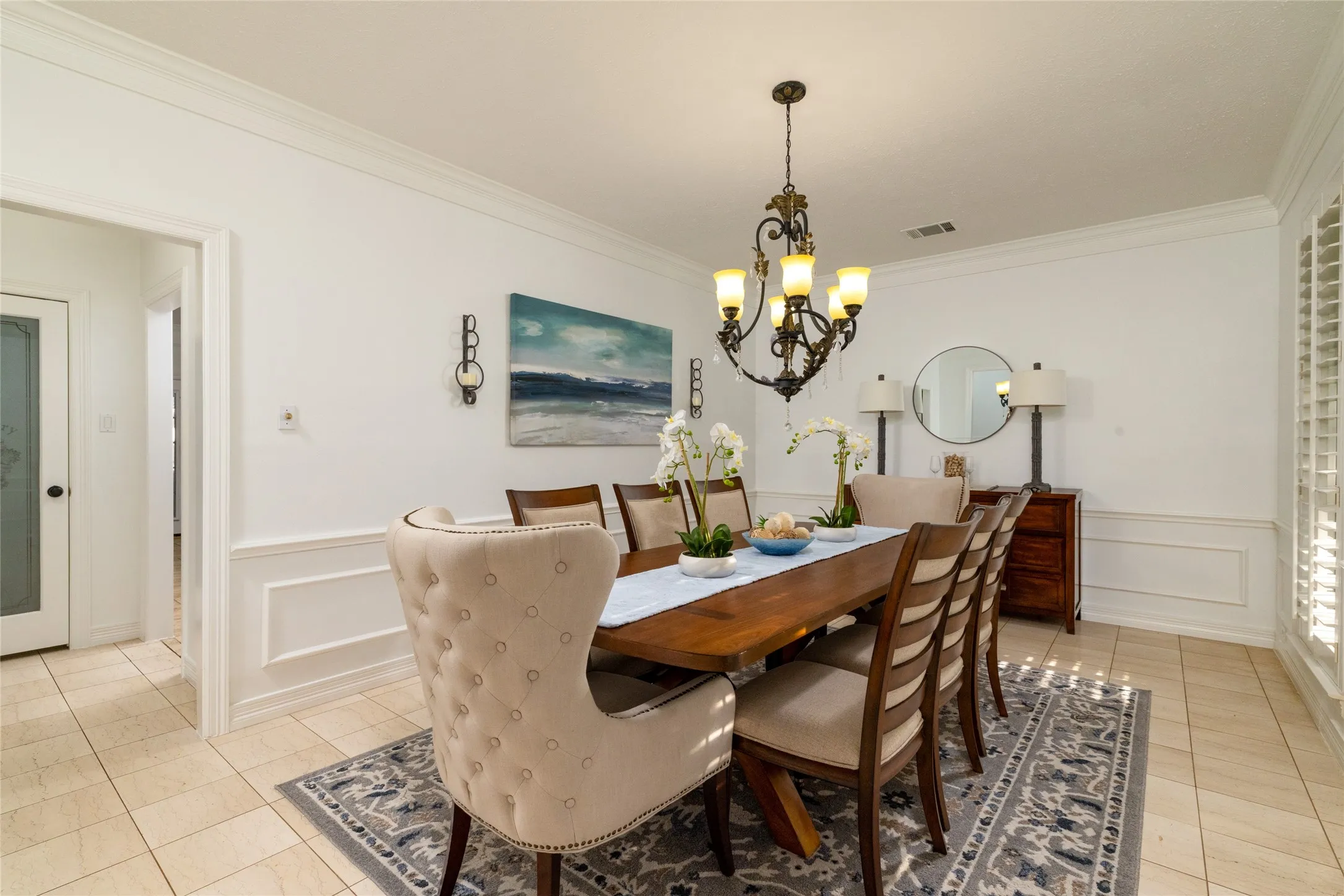 Formal dining can comfortably hold a dining set for 12