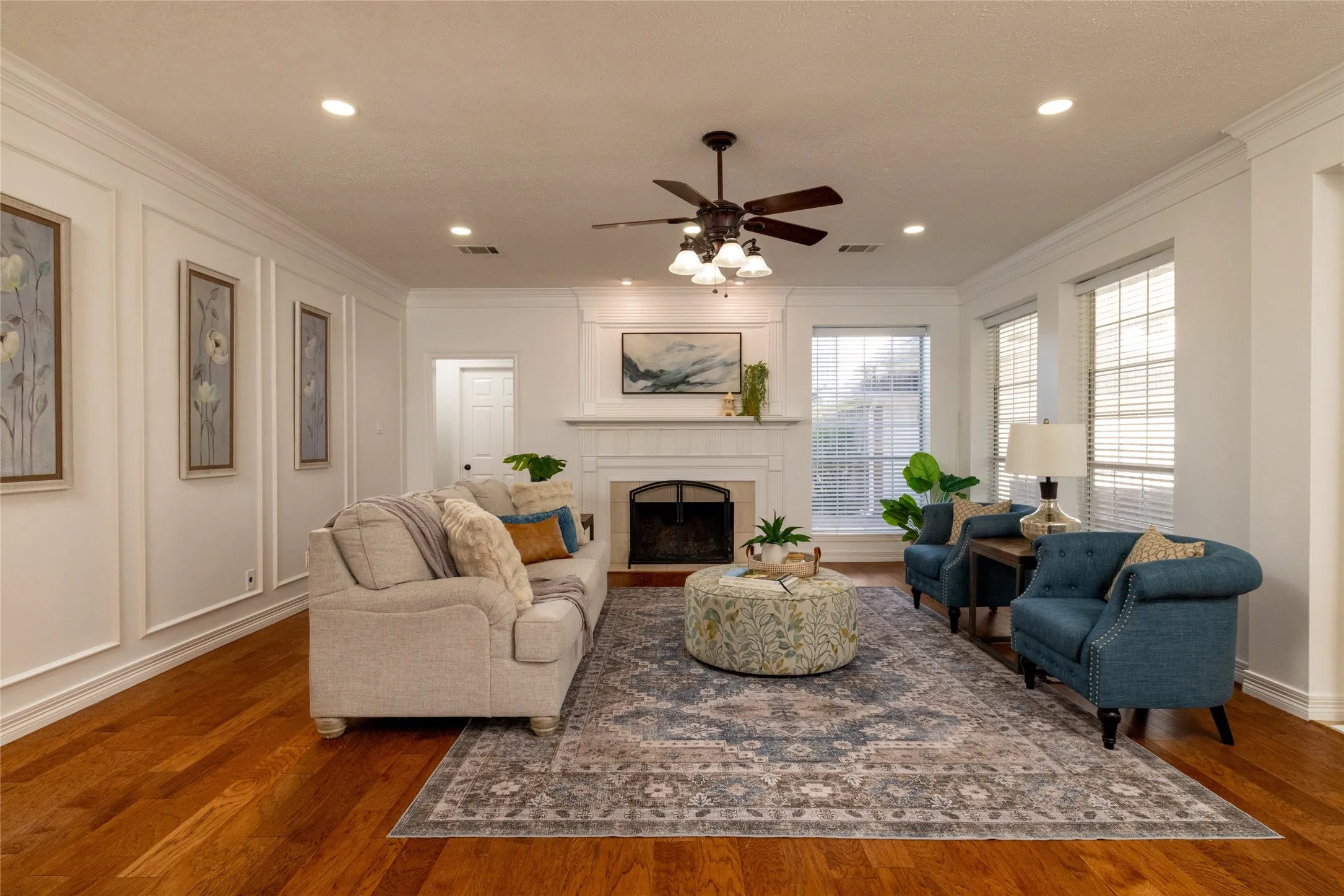 Picture frame molding and a marble fireplace for added warmth.
