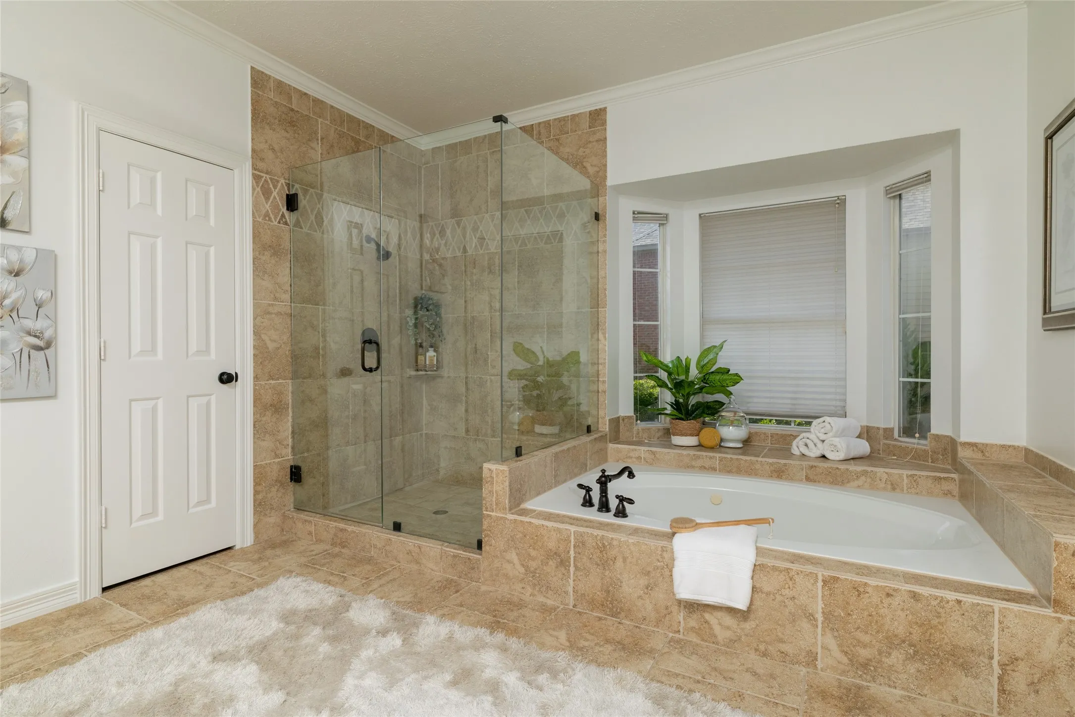 Lose yourself in the relaxing jetted tub, or enjoy the frameless glass shower.