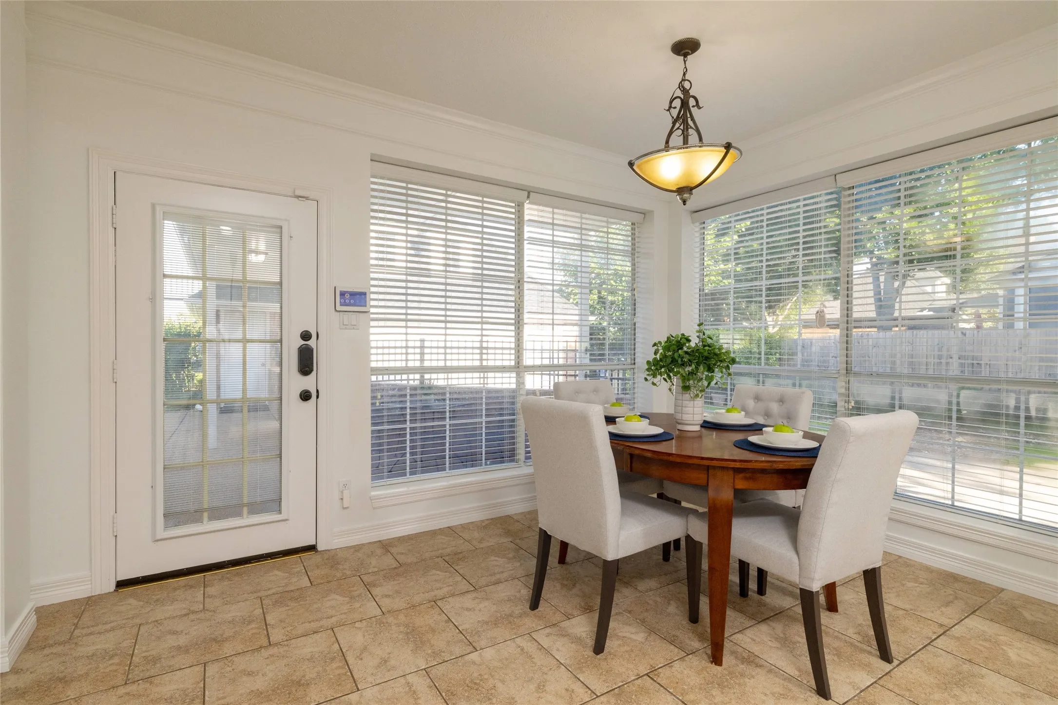 The breakfast nook leads to patio seating for morning coffee or al fresco dining