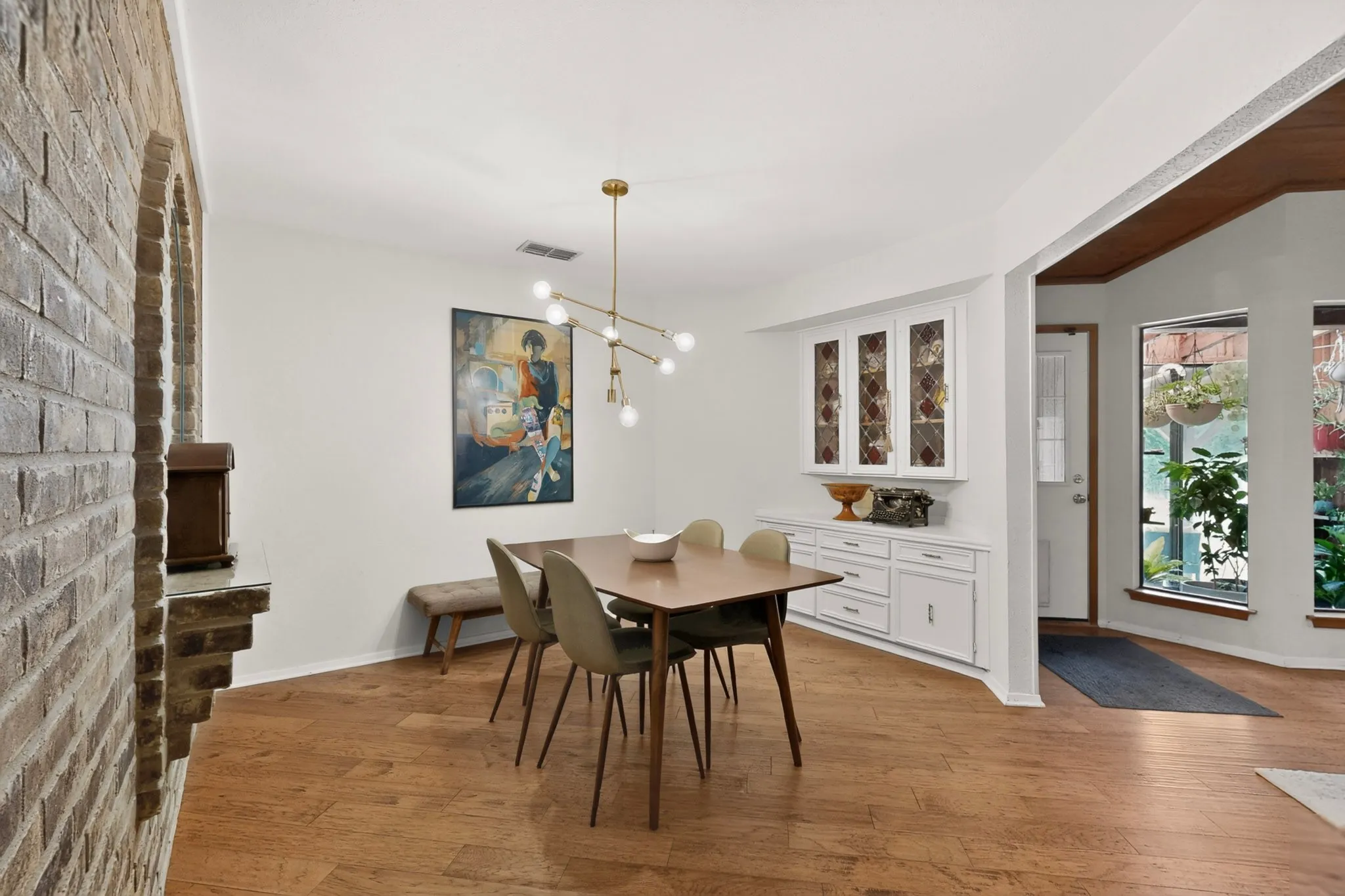 Dining area with light wood-finish flooring
