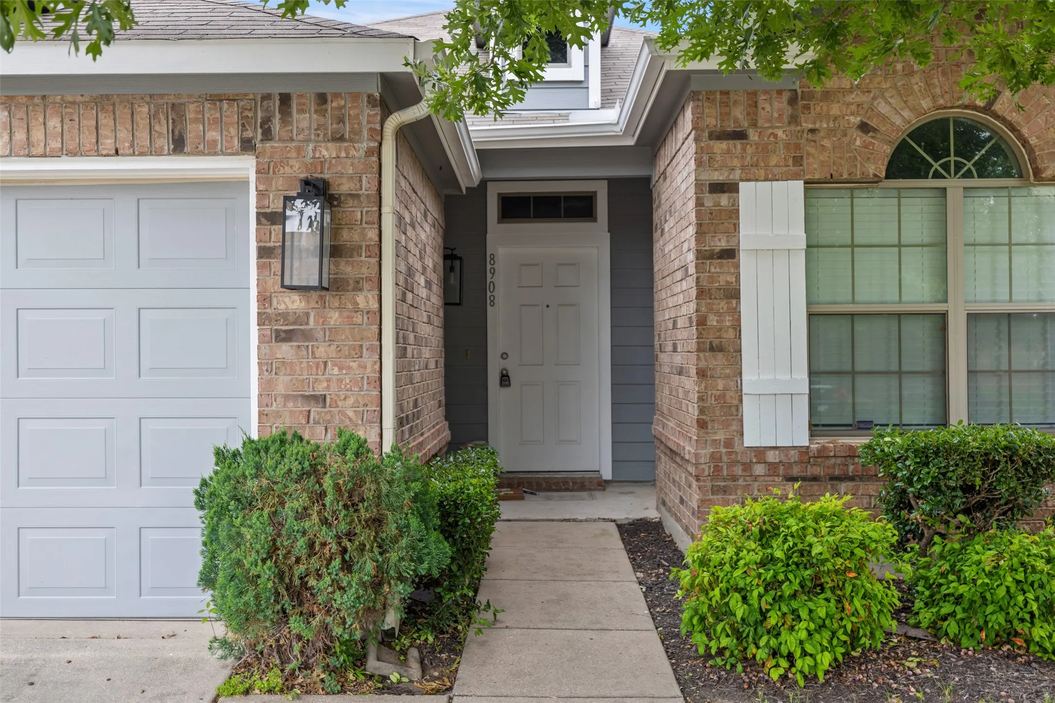 Doorway to property featuring a garage