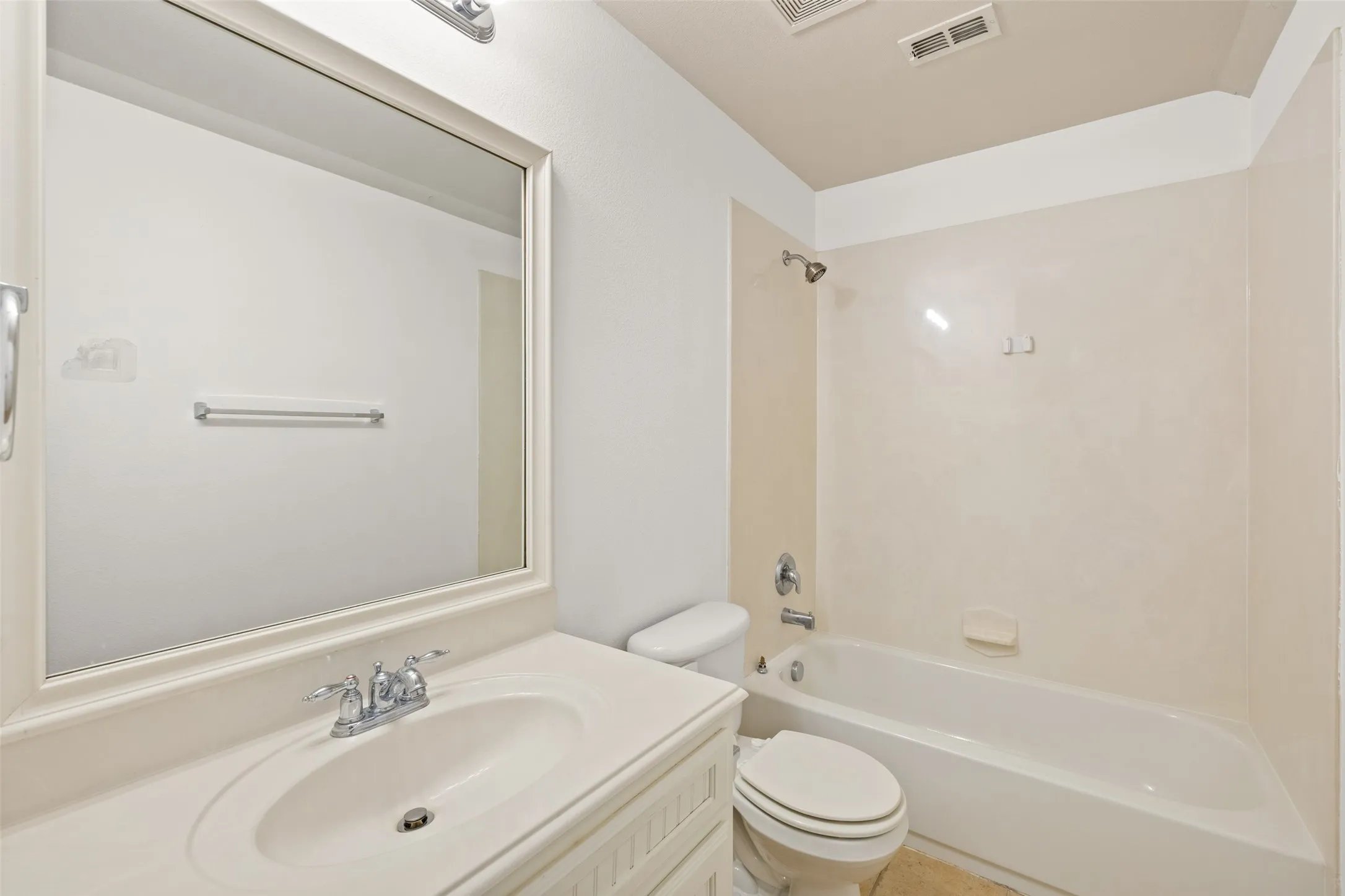 Full bathroom with shower / tub combination, vanity, and toilet