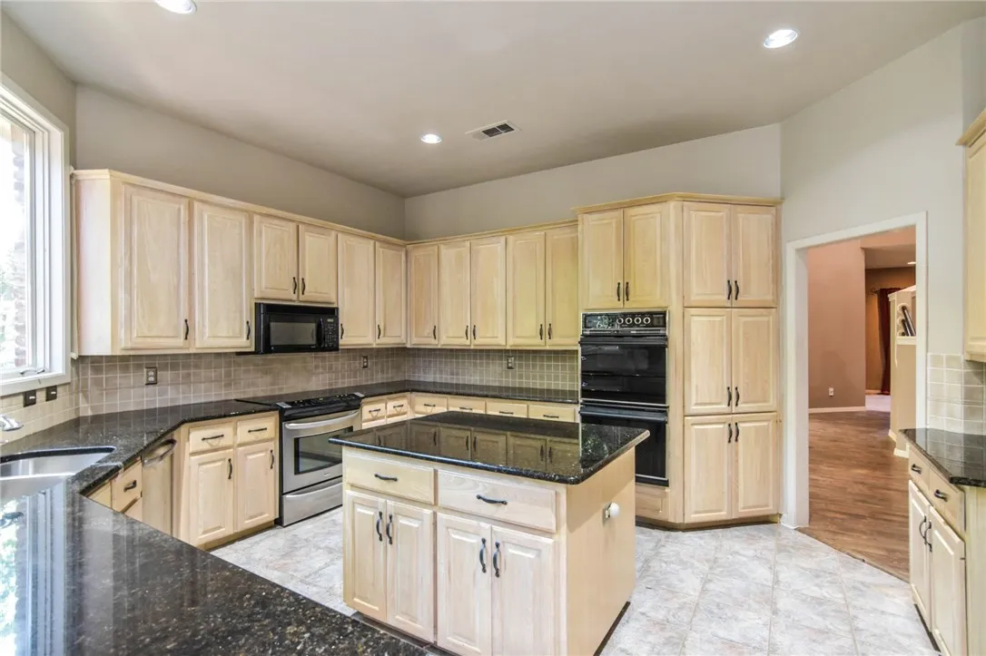 Kitchen features plenty of counter and cabinet space