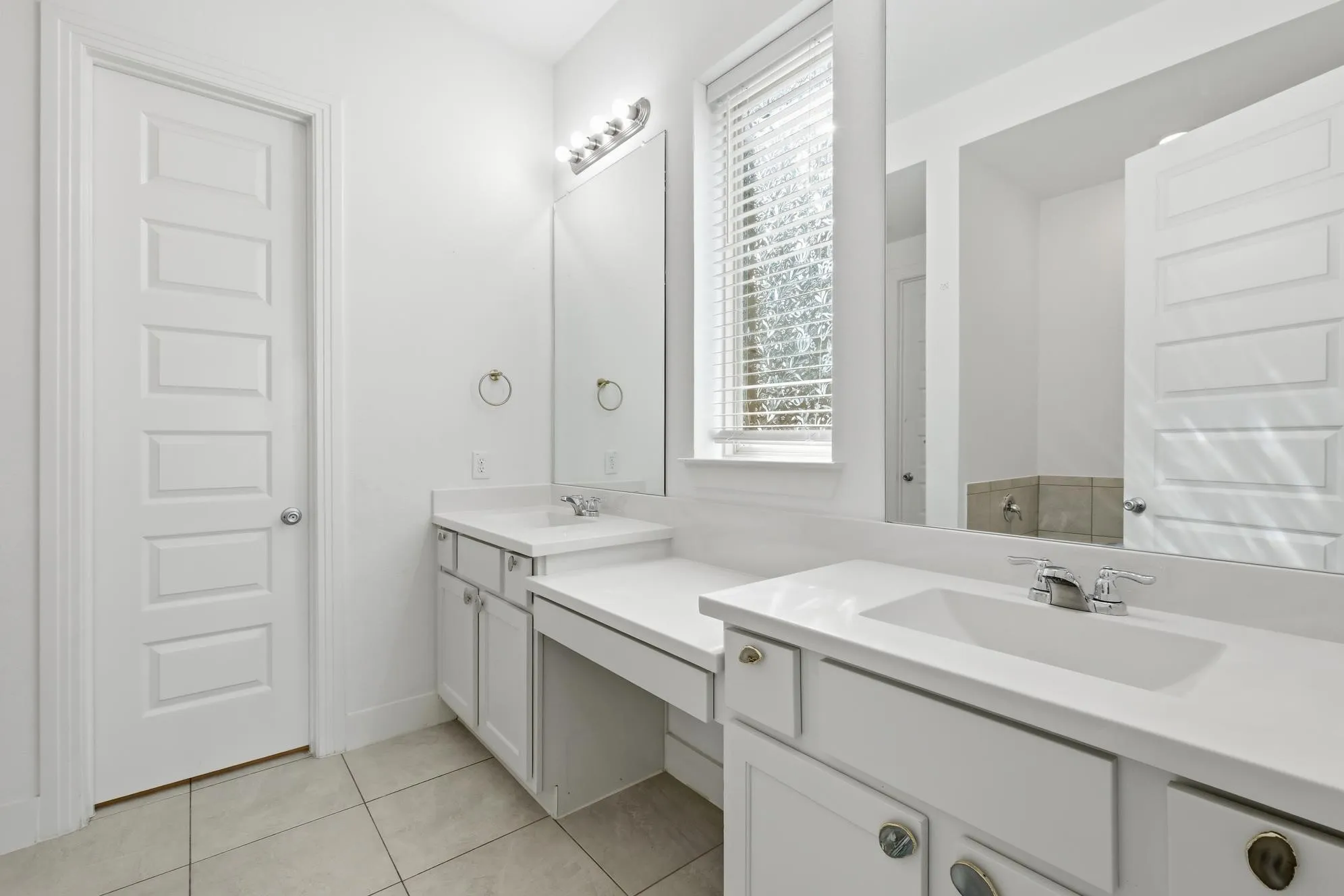 Primary bathroom with his and her spaces