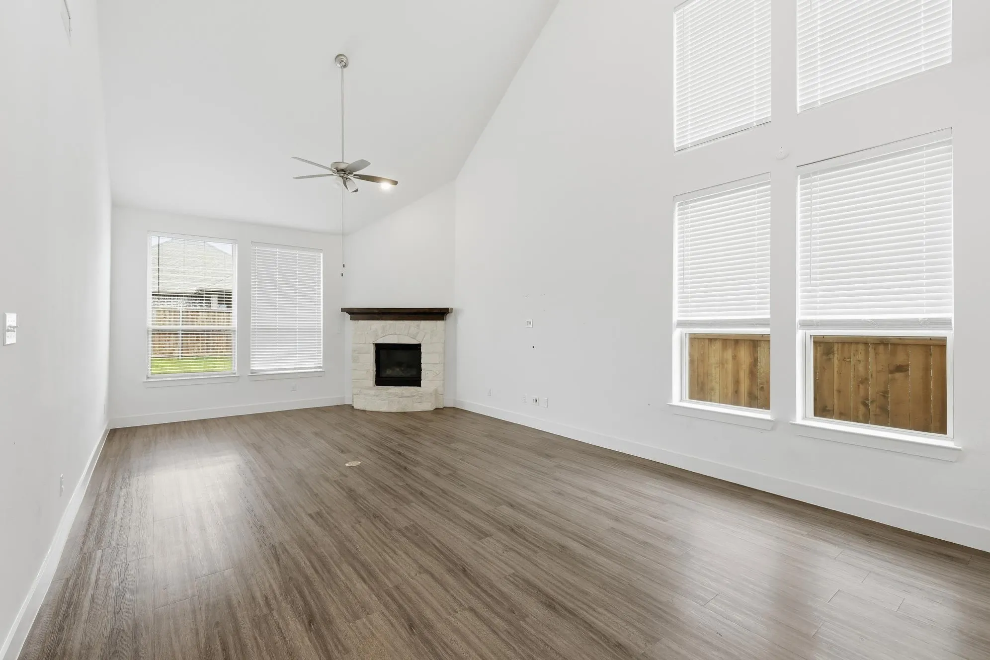 Tall Vaulted Ceilings in the family room with Brick fireplace