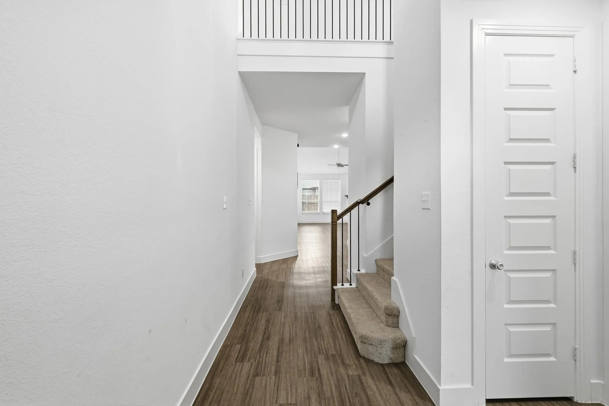 Soring celings, gorgeous luxury planks greet you upon entry