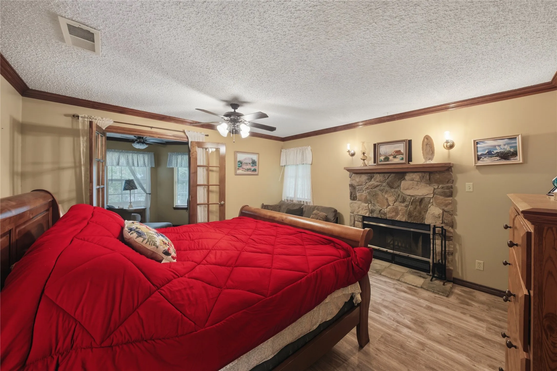 Stone fireplace with a wood mantel