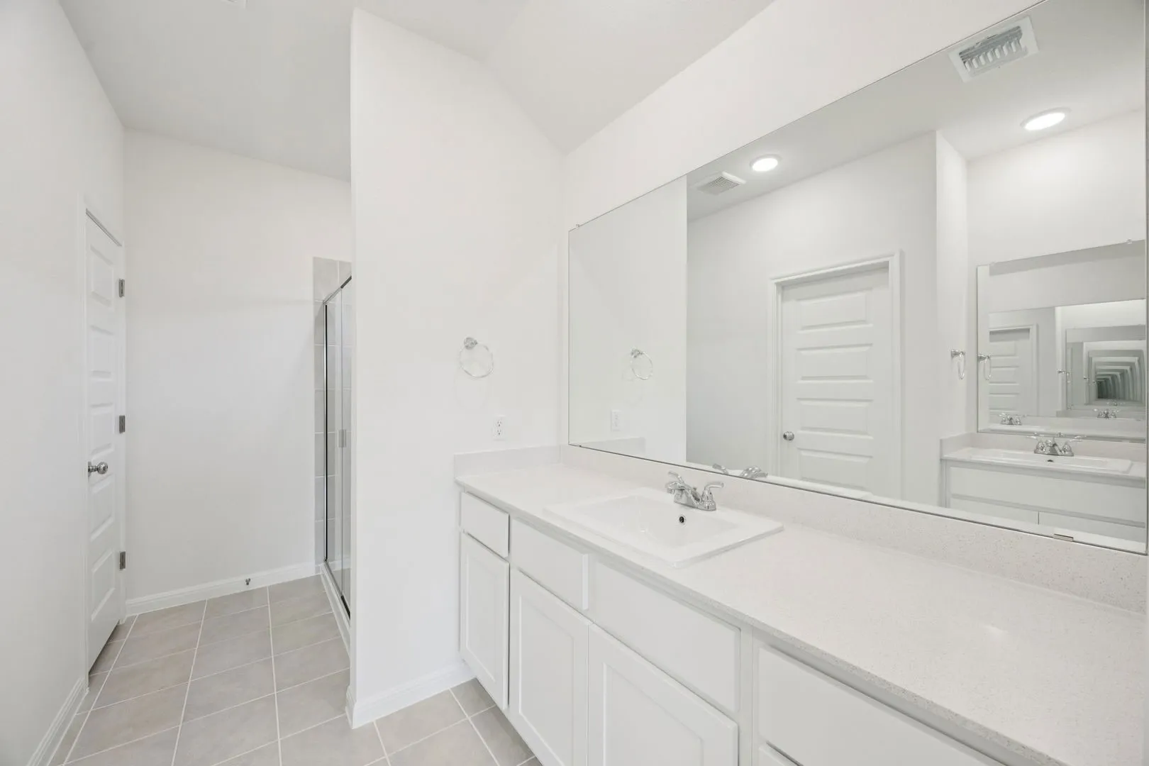 Primary Bathroom in the Cypress home plan by Trophy Signature Homes - REPRESENTATIVE PHOTO