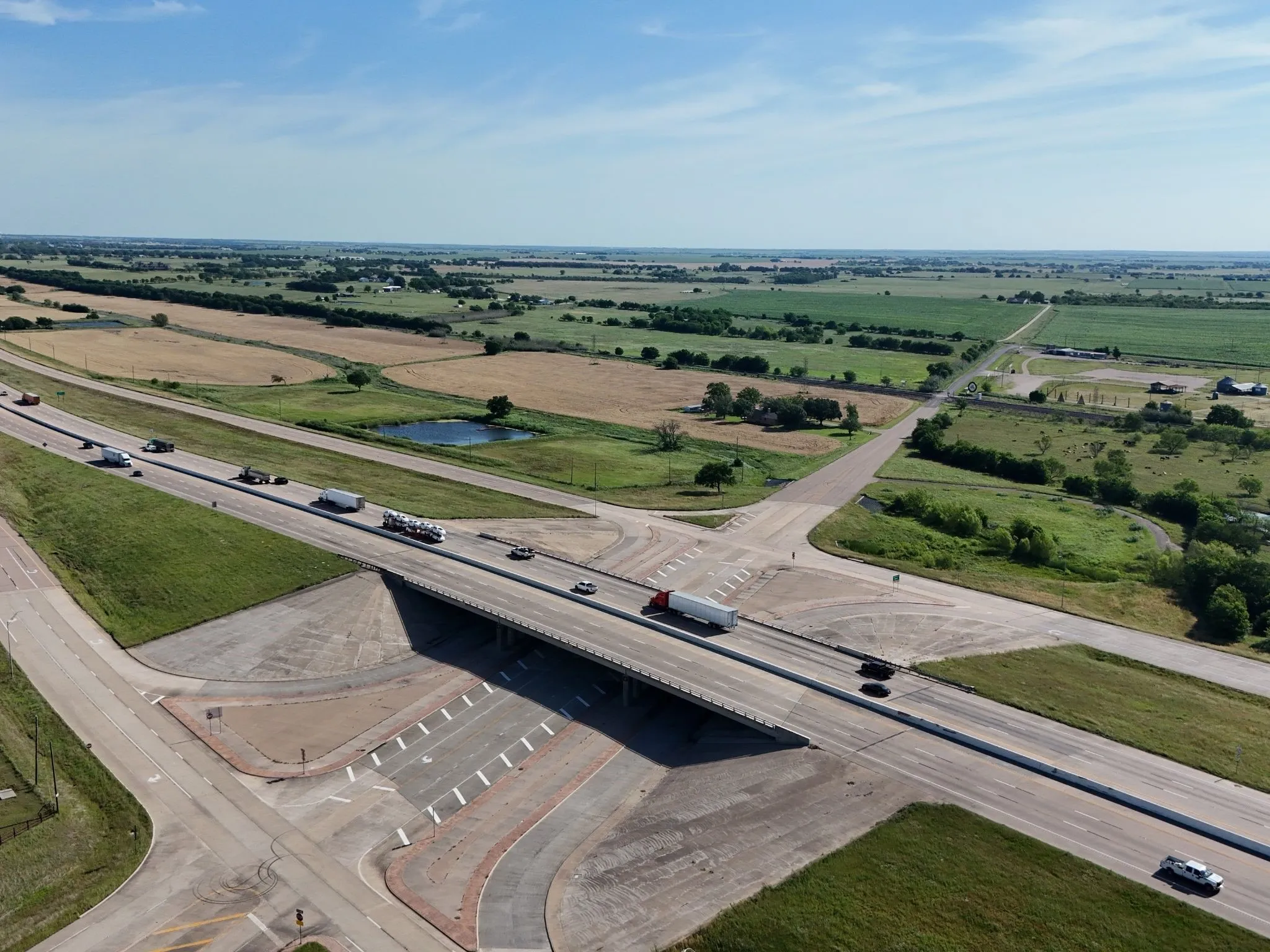 Aerial perspective showcasing a major highway overpass with multiple lanes