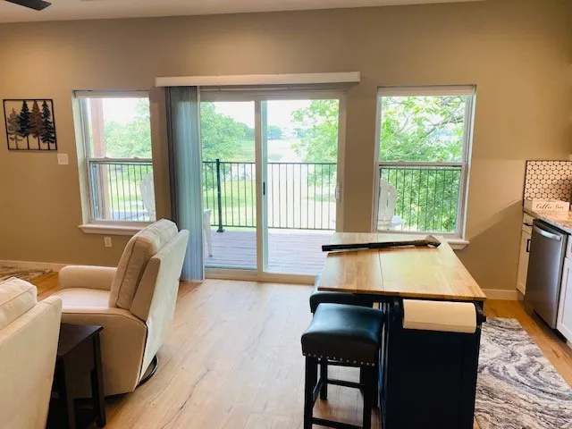 Living room featuring light wood finished floors and ceiling fan
