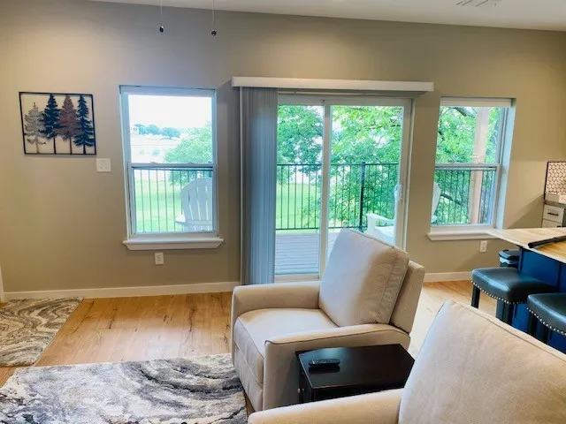 Living area featuring plenty of natural light and wood finished floors