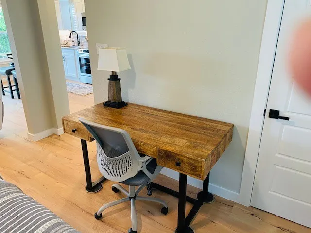 Home office with light wood-style floors