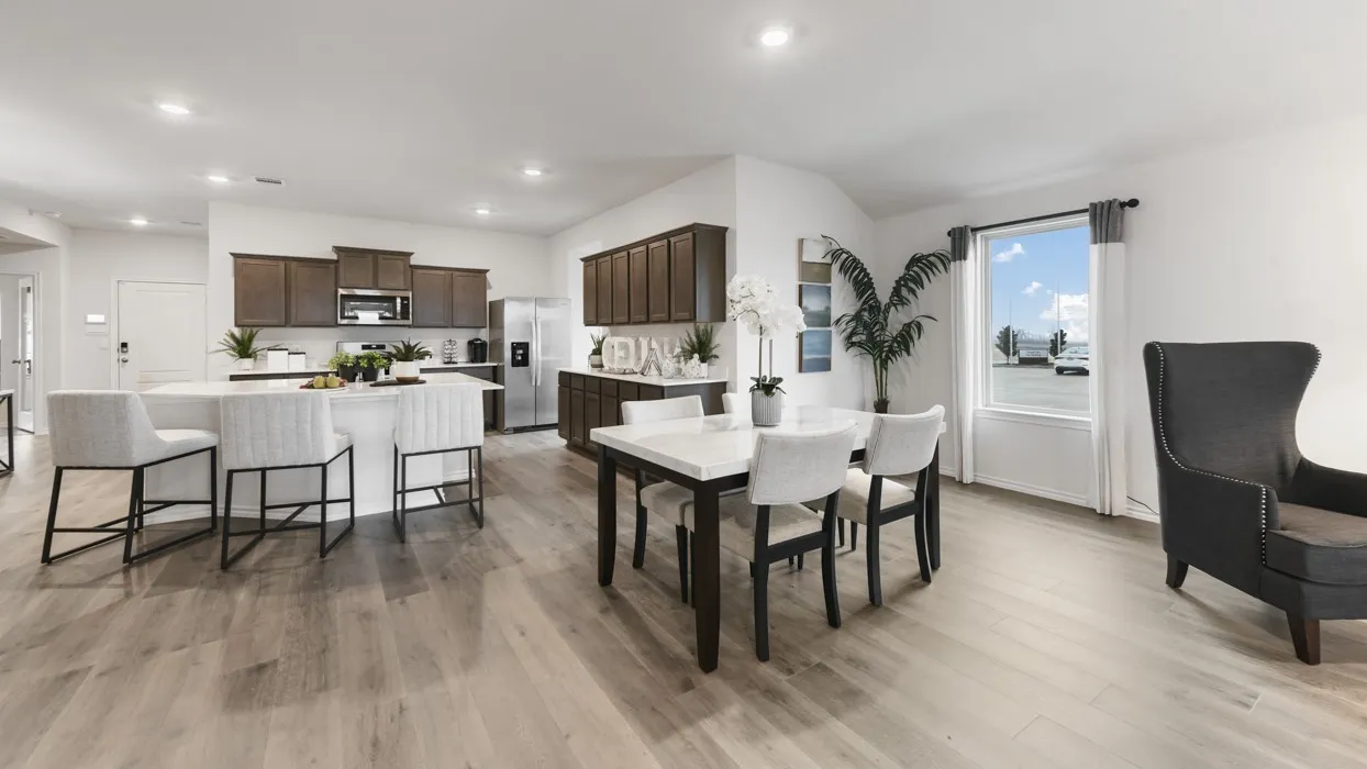 Open-concept living space featuring wood-finish flooring throughout