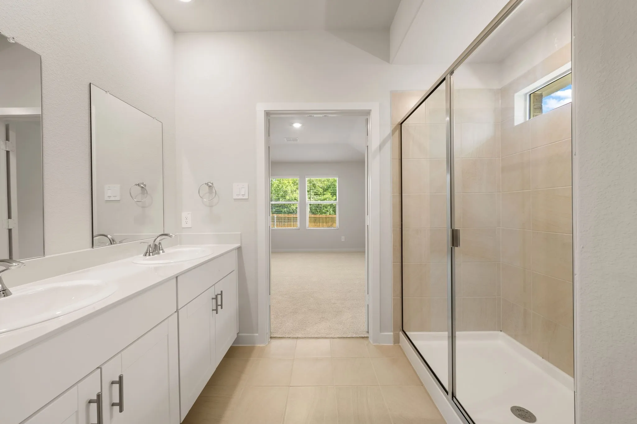 Double vanity featuring undermount sinks and chrome fixtures