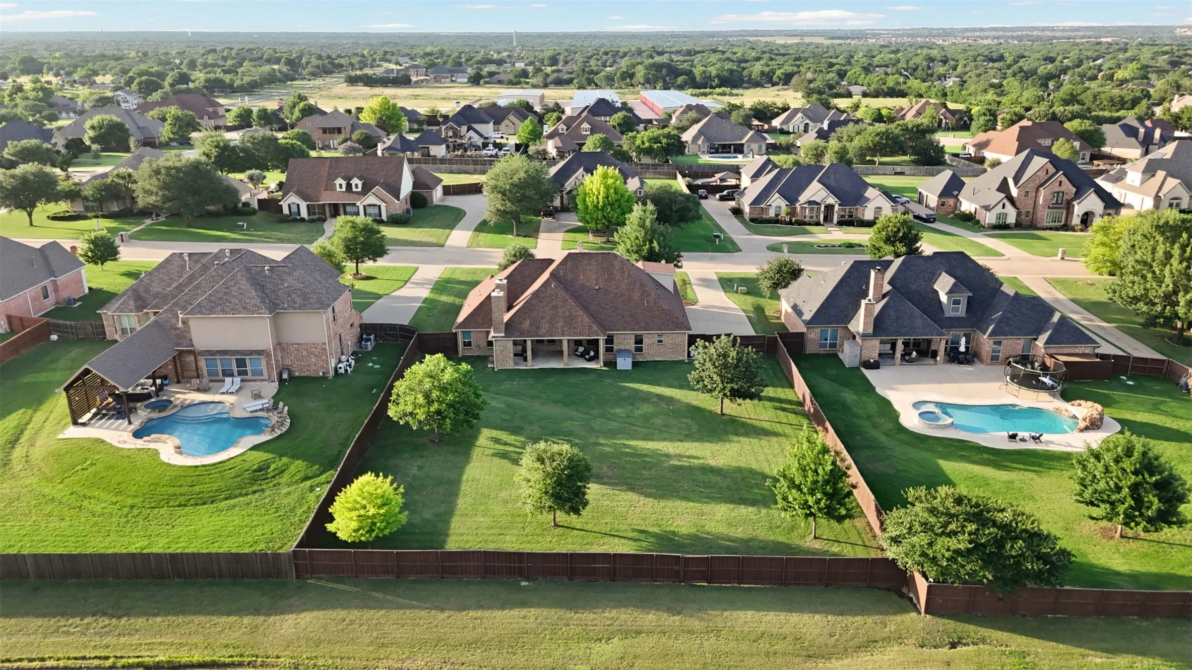 Aerial view showcasing a residential neighborhood with a variety of home styles