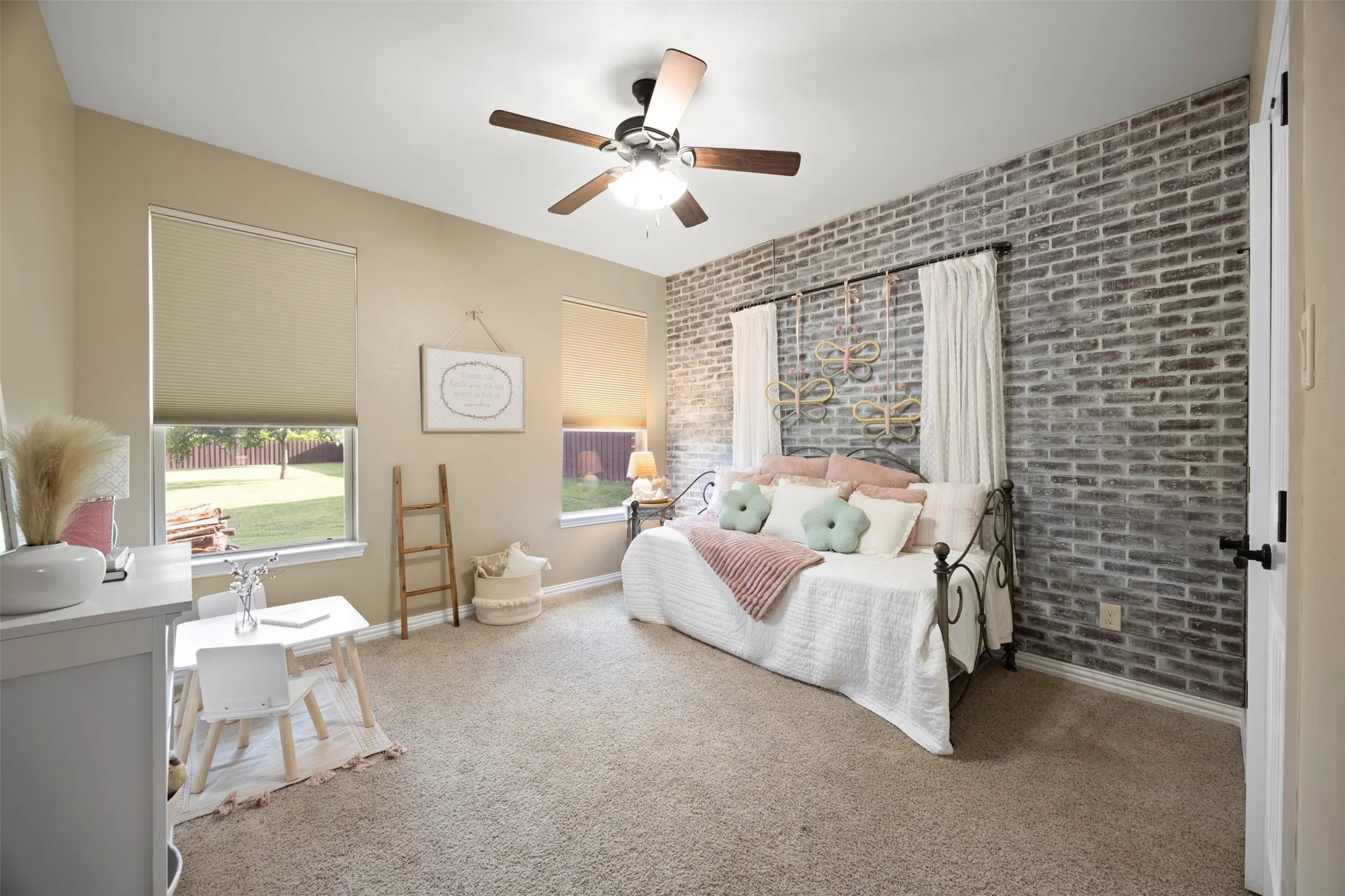 Accent wall featuring a brick finish
