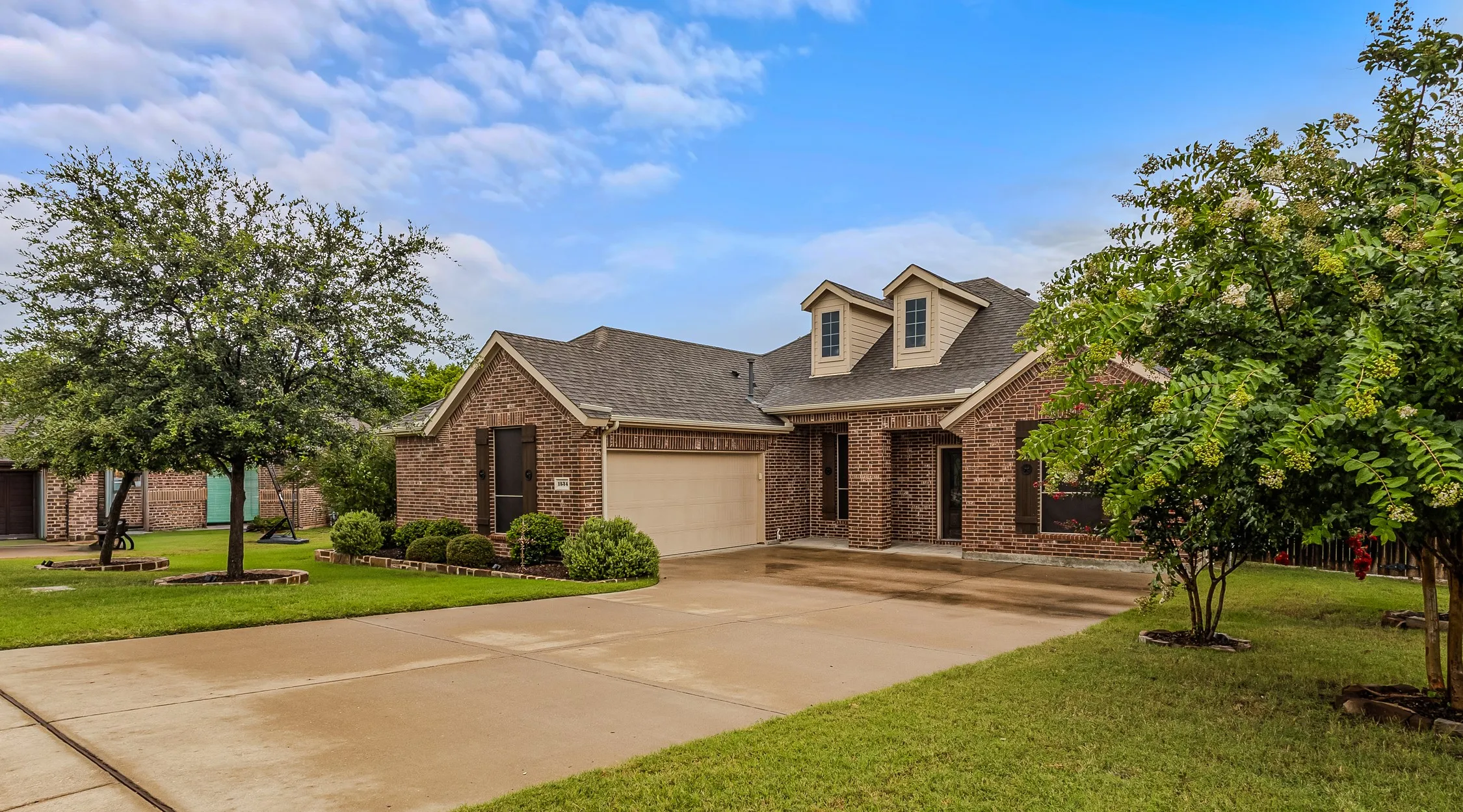 Beautiful Curb Appeal.  Brick exterior with a prominent two-car garage